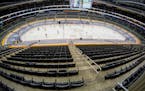 The Ice Crew clears the snow from the rink during a timeout during the second period of an NHL hockey game between the Pittsburgh Penguins and the Was