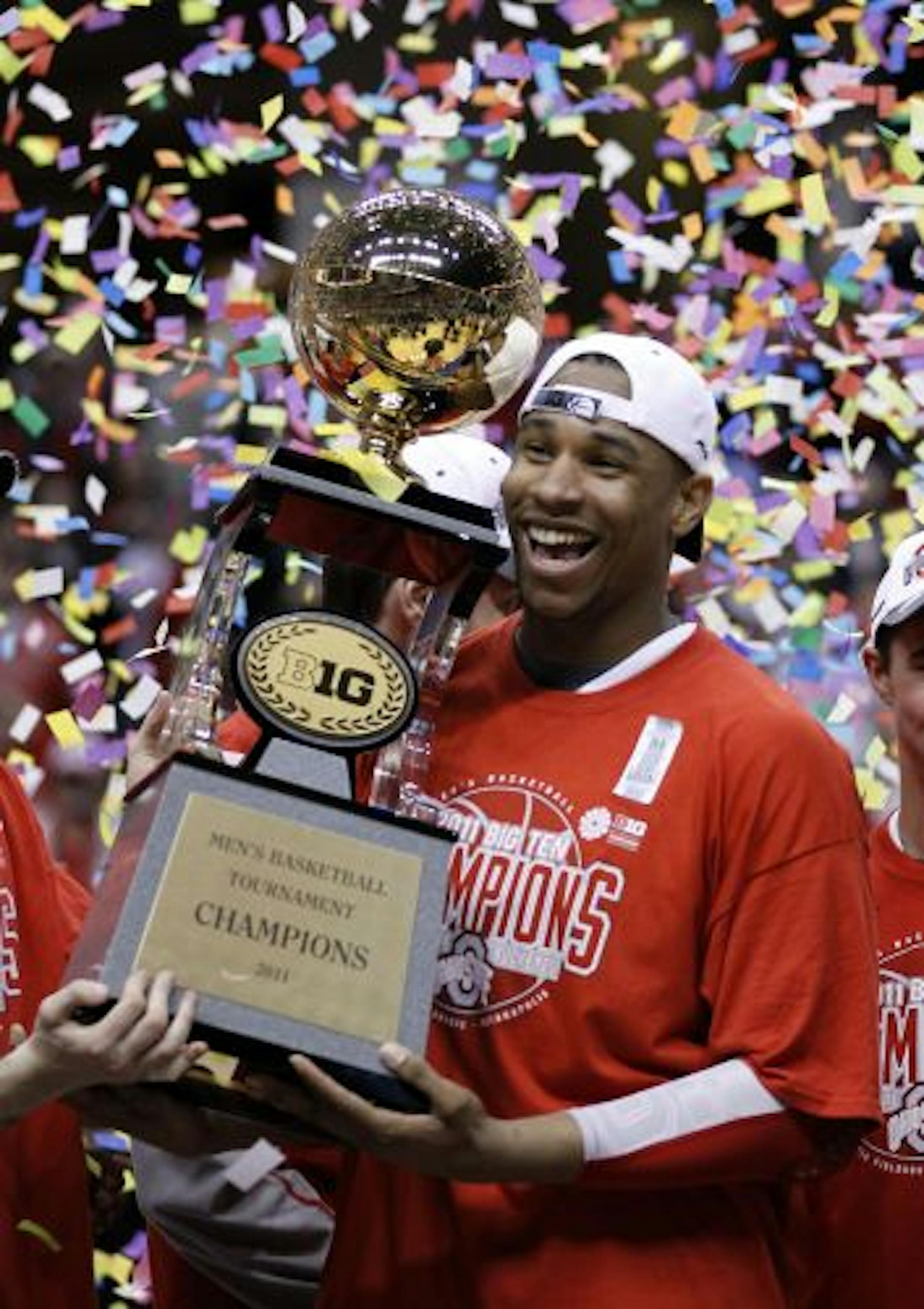Ohio State forward Jared Sullinger smiled as he carried the trophy following Ohio State's 71-60 win over Penn State in the Big Ten Conference tournament final in Indianapolis. The Buckeyes were later named the No. 1 overall seed in the NCAA tournament.