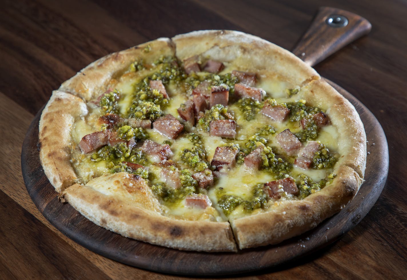 Mortadella Pizza &#x2013; fontina, pistachio pesto, lemon, mint ] CARLOS GONZALEZ &#x2022; cgonzalez@startribune.com &#x2013; Minneapolis, MN &#x2013; July 11, 2019, Restaurant review: Giulia at the Emery hotel in downtown Minneapolis, a contemporary northern Italian restaurant that's the work of chefs Steven Brown and Josh Hedquist.