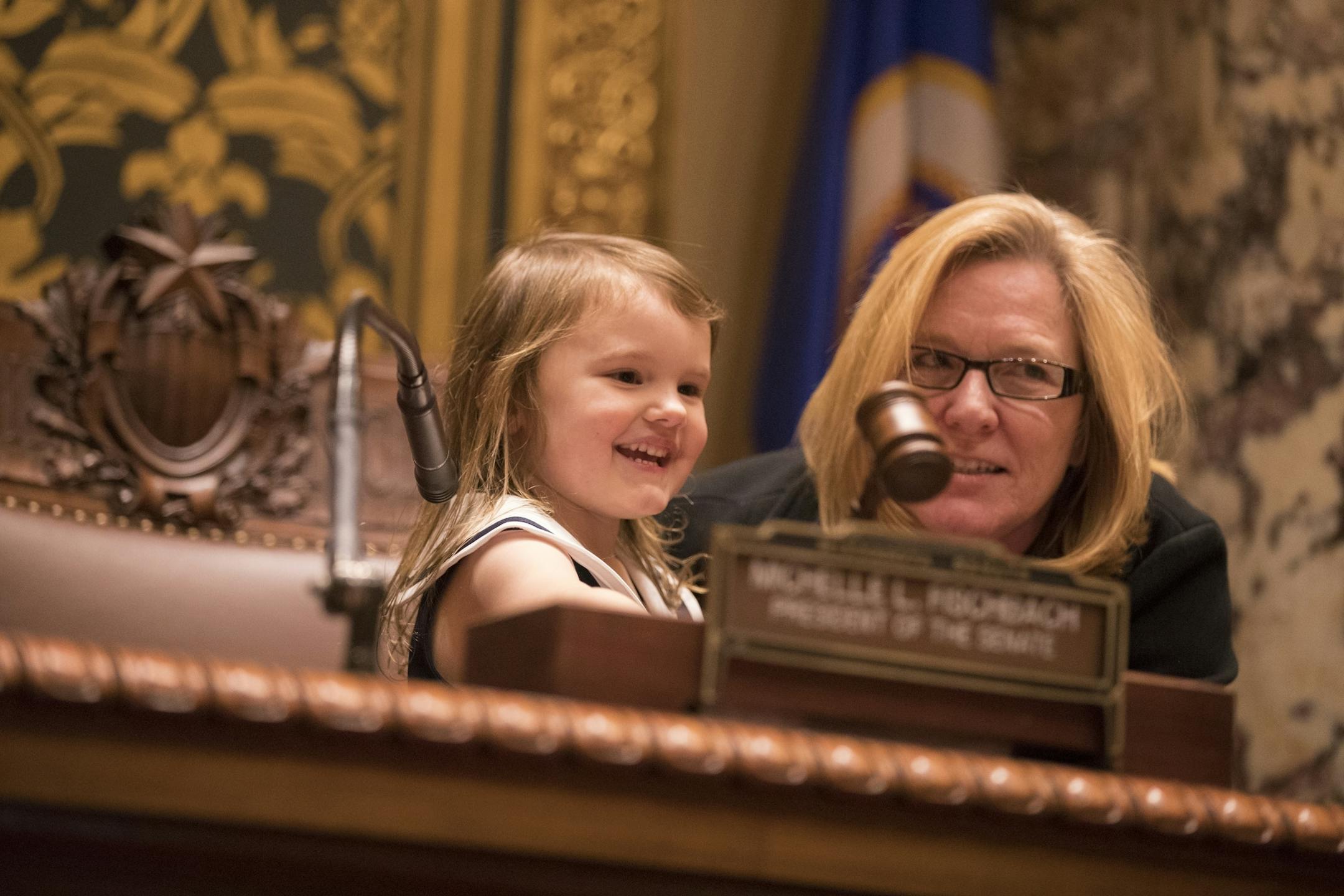 President of the Senate Michelle Fischbach, R-Paynesville, lets her granddaughter Ava Eisenbacher, 4, use the gavel after the session in the Minnesota Senate chambers.