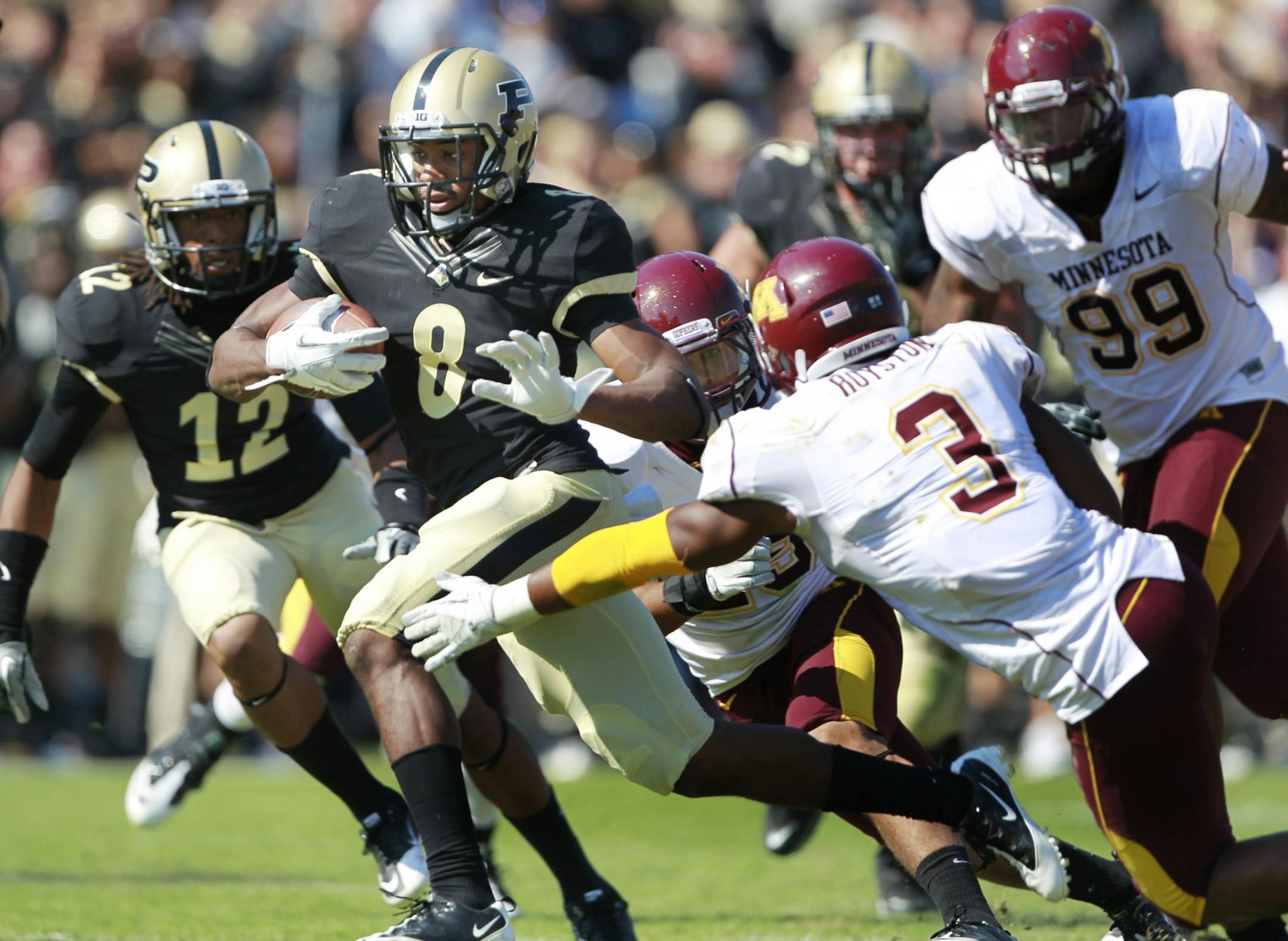 Purdue running back Raheem Mostert ran past Minnesota's defensive back Kim Royston for 25 yard third quarter touchdown, during Saturday October 8, 2011Big Ten action between Minnesota and Purdue at Ross-Ade Stadium in West Lafayette, Indiana.