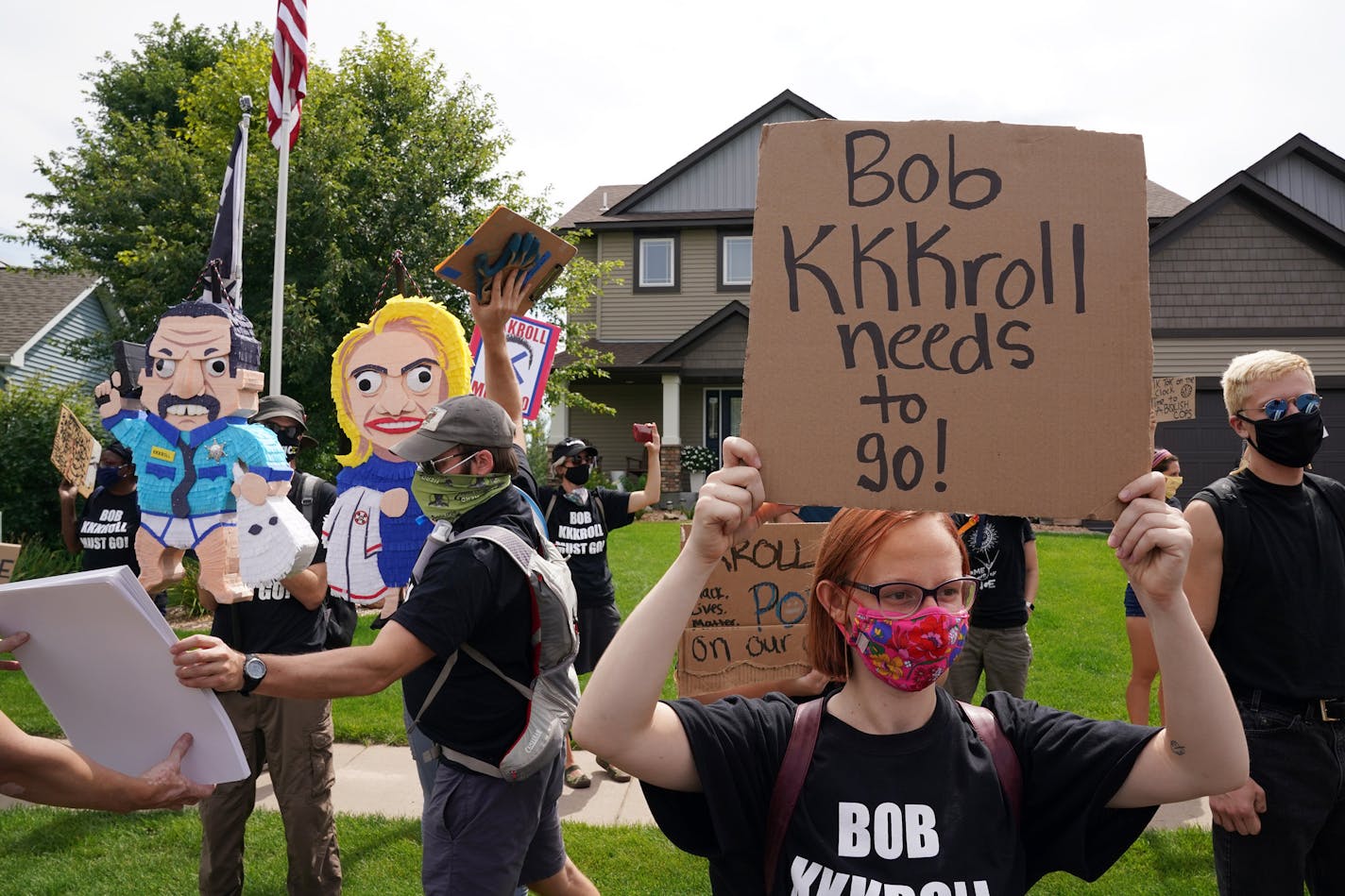 Anna Ruday of Minneapolis stood with more than 100 Black Lives Matter protesters as they rallied outside the home of Minneapolis Police Federation President Bob Kroll and his wife WCCO reporter Liz Collin in a continued effort to get them both fired from their jobs Saturday.