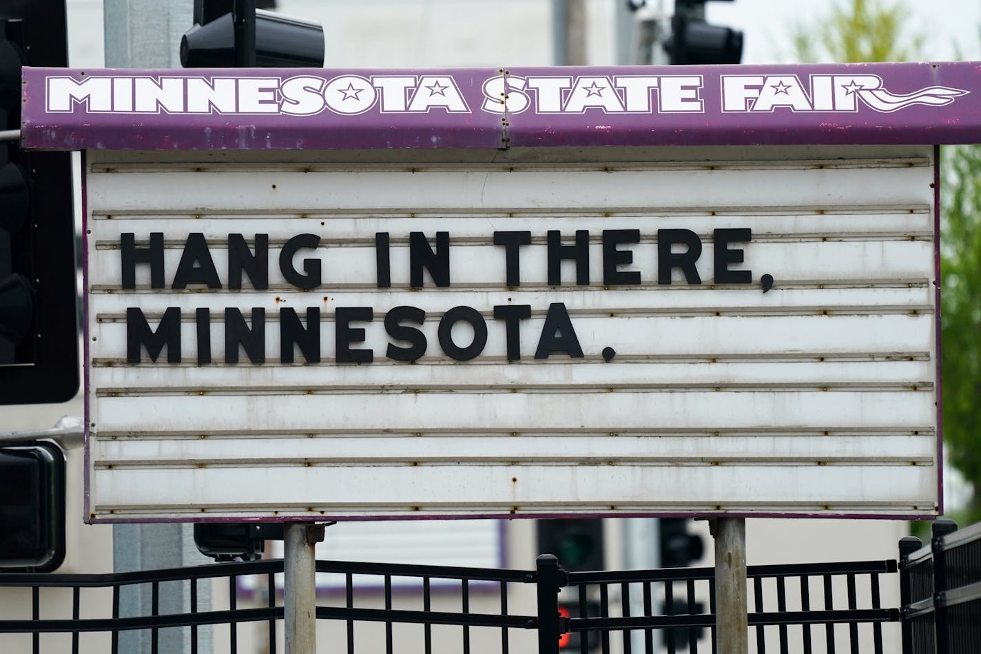 A sign of encouragement stood at the main entrance to the State Fairgrounds Thursday.