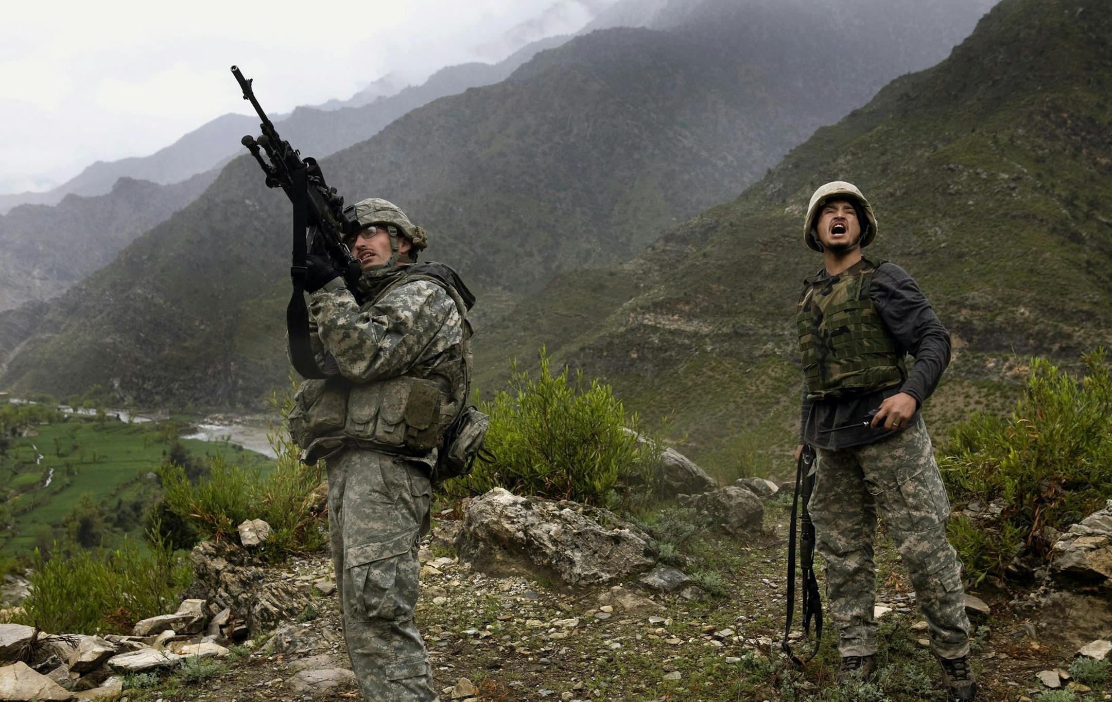 (NYT22) NEAR WANAT, Afghanistan -- April 12, 2009 -- AFGHAN-2 -- U.S. soldiers with the First Battalion, 26th Infantry, on patrol near Wanat, in Afghanistan's Kunar Province on April 7, 2009. The local insurgents in Kunar, augmented by foreign fighters, had been hardened by years of guerrilla war against top American divisions. (Tyler Hicks/The New York Times)