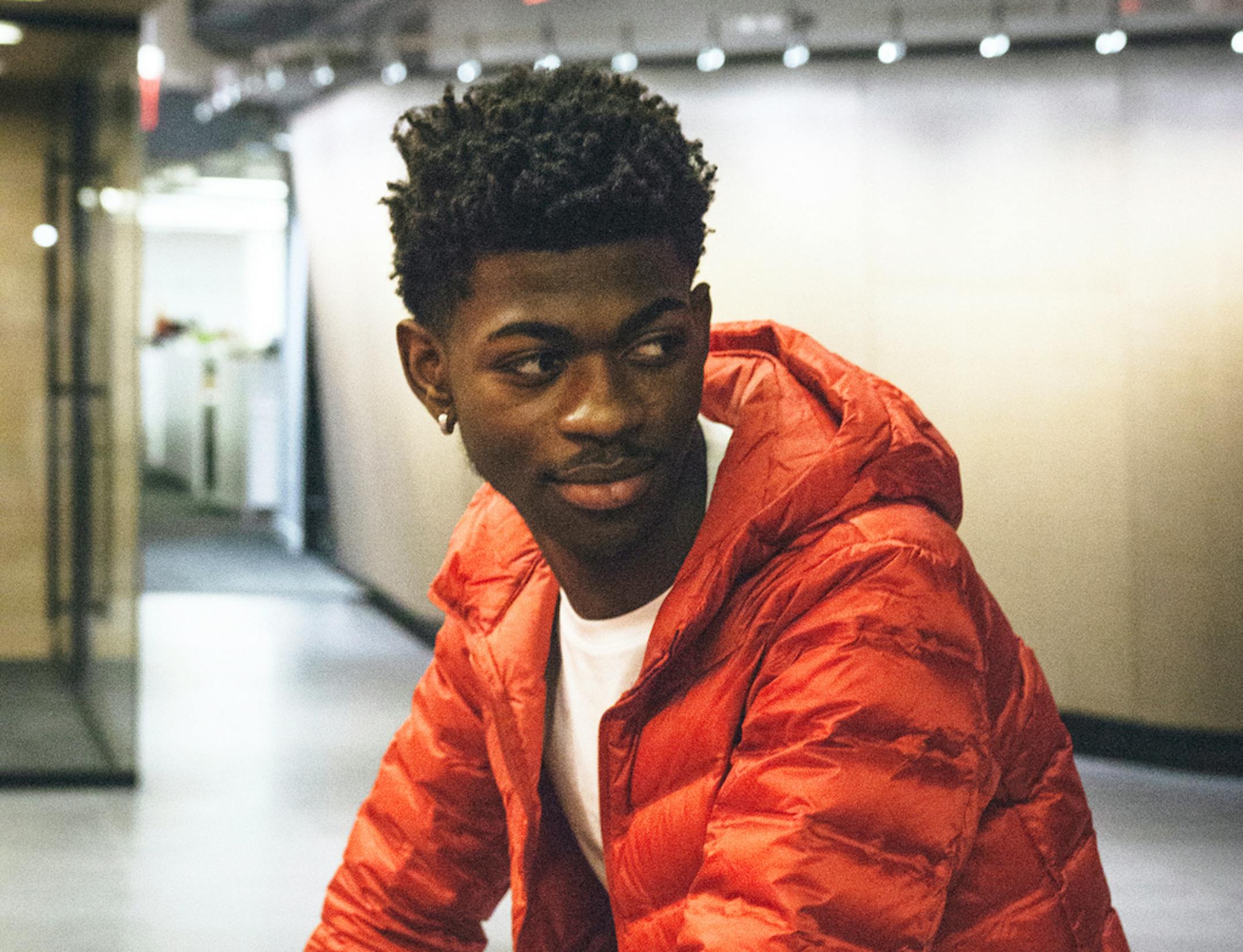 This undated image provided by Columbia Records shows rapper Lil Nas X, whose viral hit "Old Town Road" was removed from Billboard's country charts because they said it wasn't country enough. (Eric Lagg/Courtesy of Columbia Records via AP)