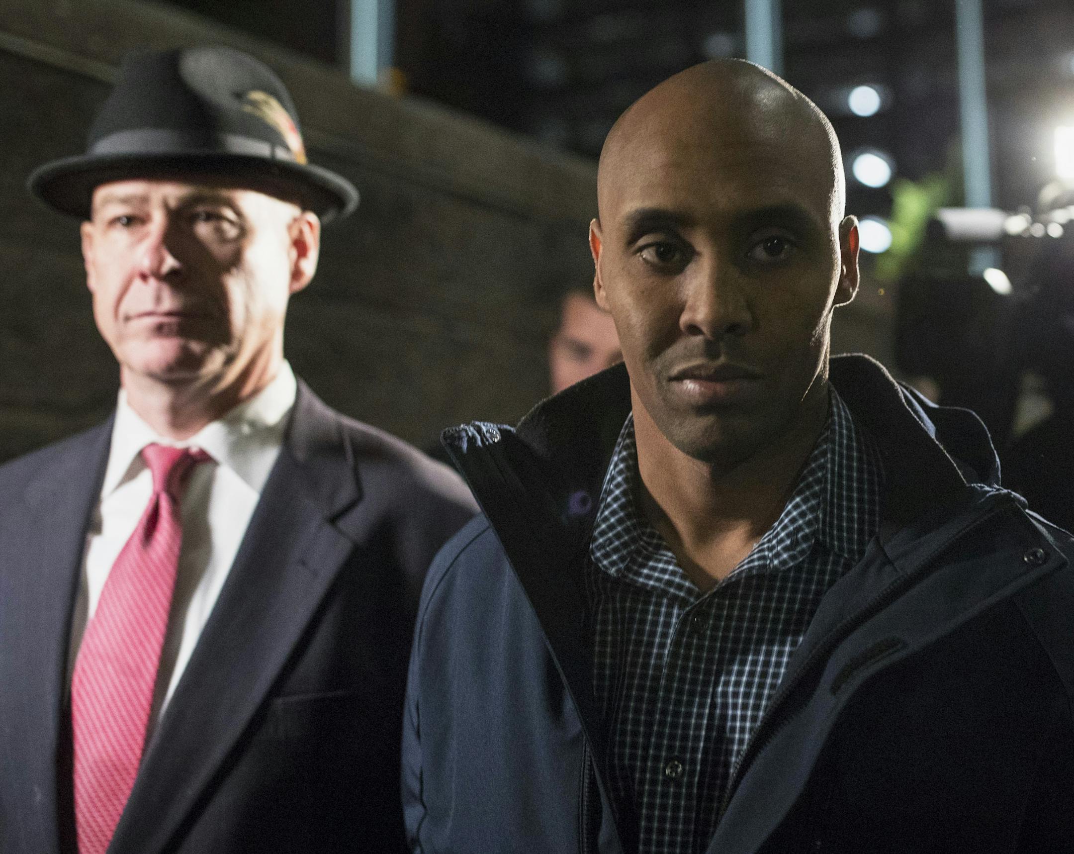 Former Minneapolis Police Officer Mohamed Noor leaves the Hennepin County Public Safety Facility with his attorney, Thomas Plunkett, after posting bail in Minneapolis on Wednesday, March 21, 2018. The police officer who was with Noor, charged with murder and manslaughter in the death of an unarmed Australian woman, said both men "got spooked" when she approached their SUV, and that the partner feared for his life. But prosecutors say Noor acted recklessly and was not justified in using deadly fo