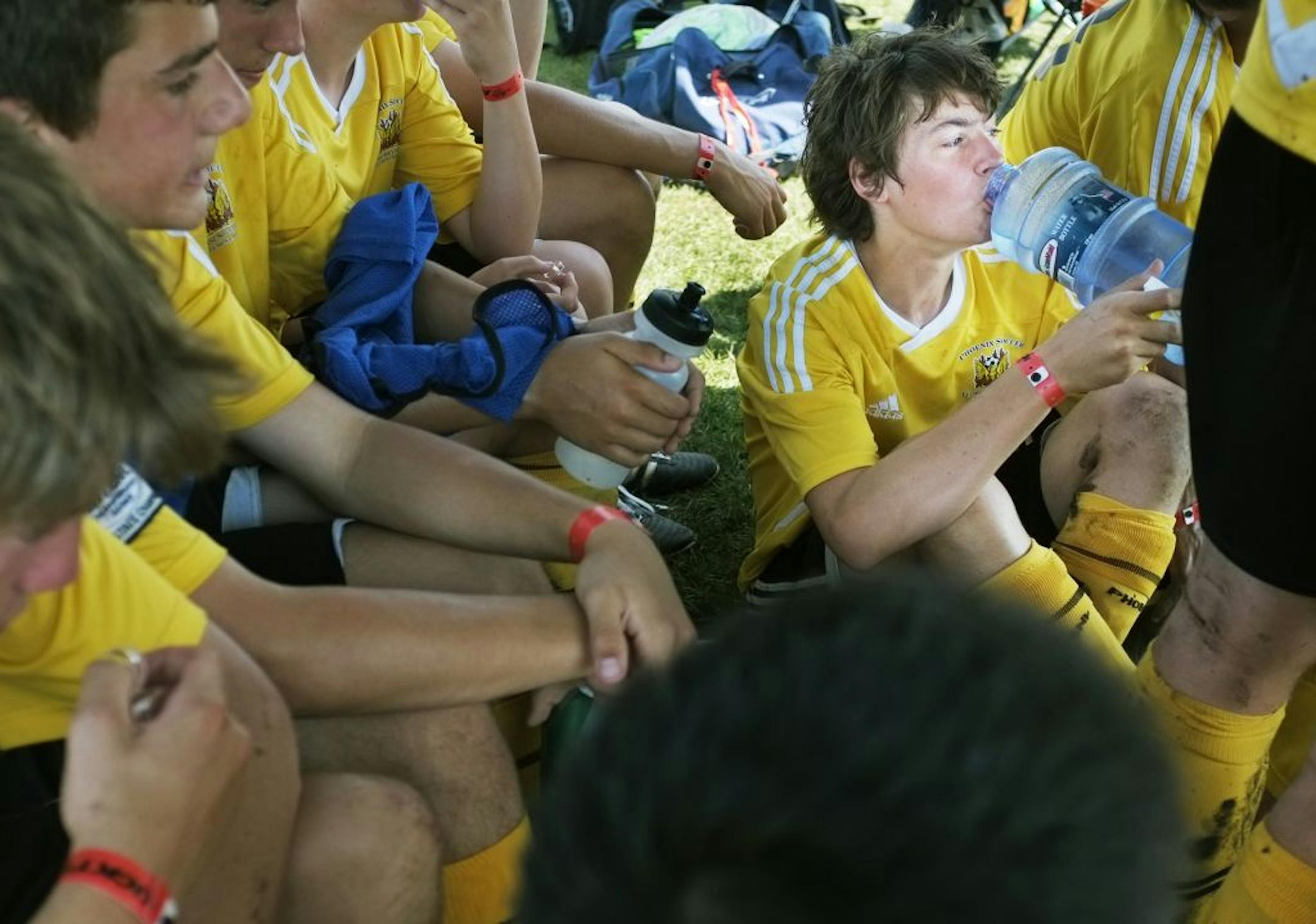 Keegan O'Brien of the Phoenix 96 Alaska team chugged some water to stay cool in the stifling heat Wednesday during the Schwan's USA Cup at the National Sports Center in Blaine. There was a water break in each half to help keep the kids hydrated in the high temperatures and humidity.
