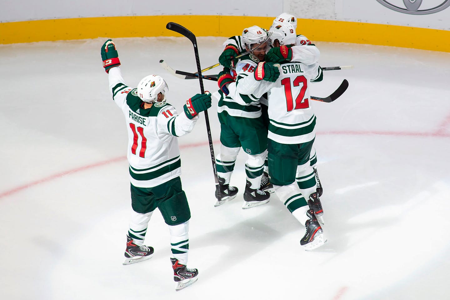 Zach Parise, Eric Staal and Kevin Fiala celebrated after a power-play goal by defenseman Jared Spurgeon (46) gave the Wild breathing room Sunday.