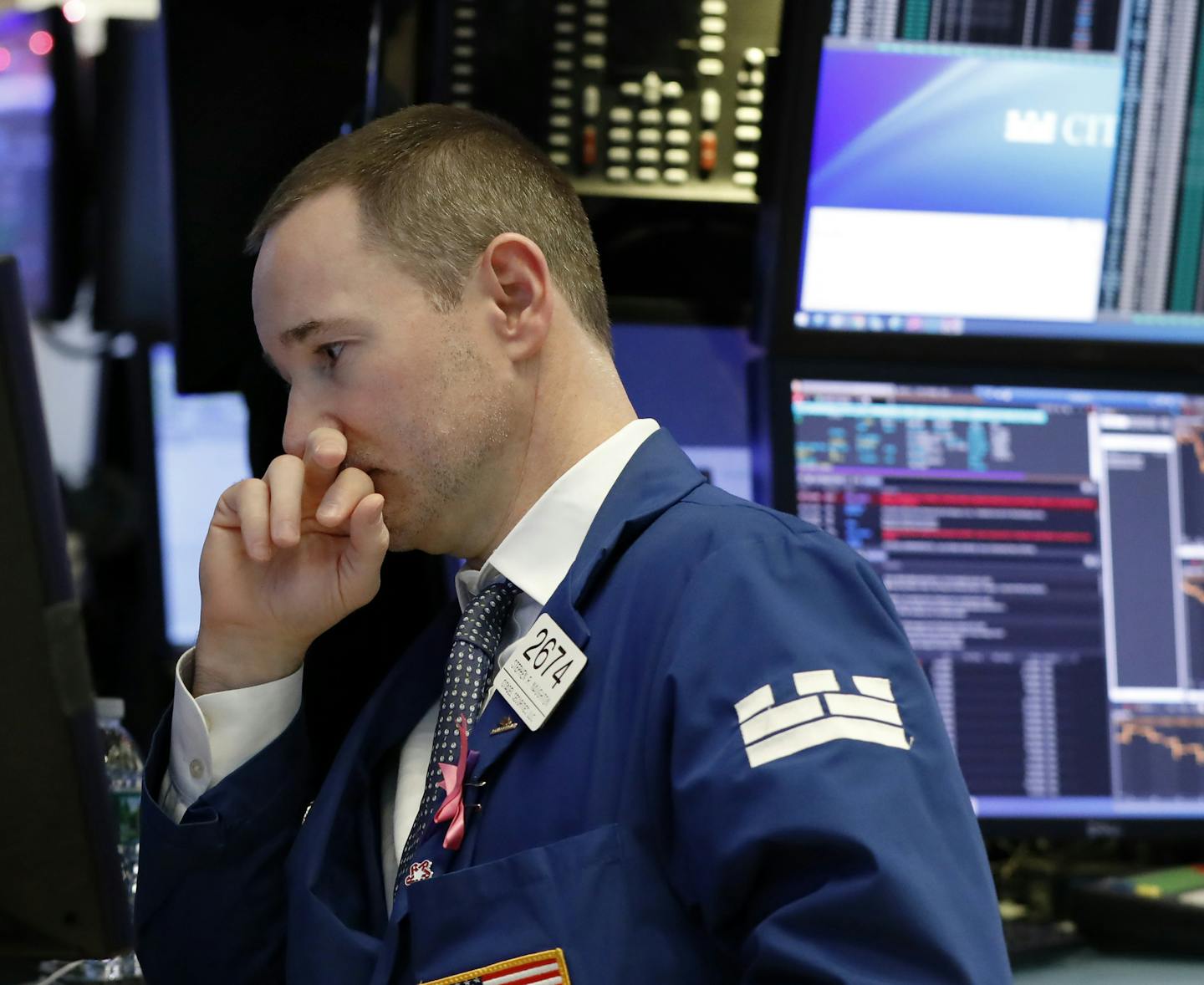 Specialist Stephen Naughton works on the floor of the New York Stock Exchange, Thursday, Dec. 27, 2018. Wall Street's wild Christmas week goes on, with the Dow Jones Industrial Average slumping 300 points at the open Thursday, a day after notching its biggest-ever point gain. (AP Photo/Richard Drew) ORG XMIT: NYRD103