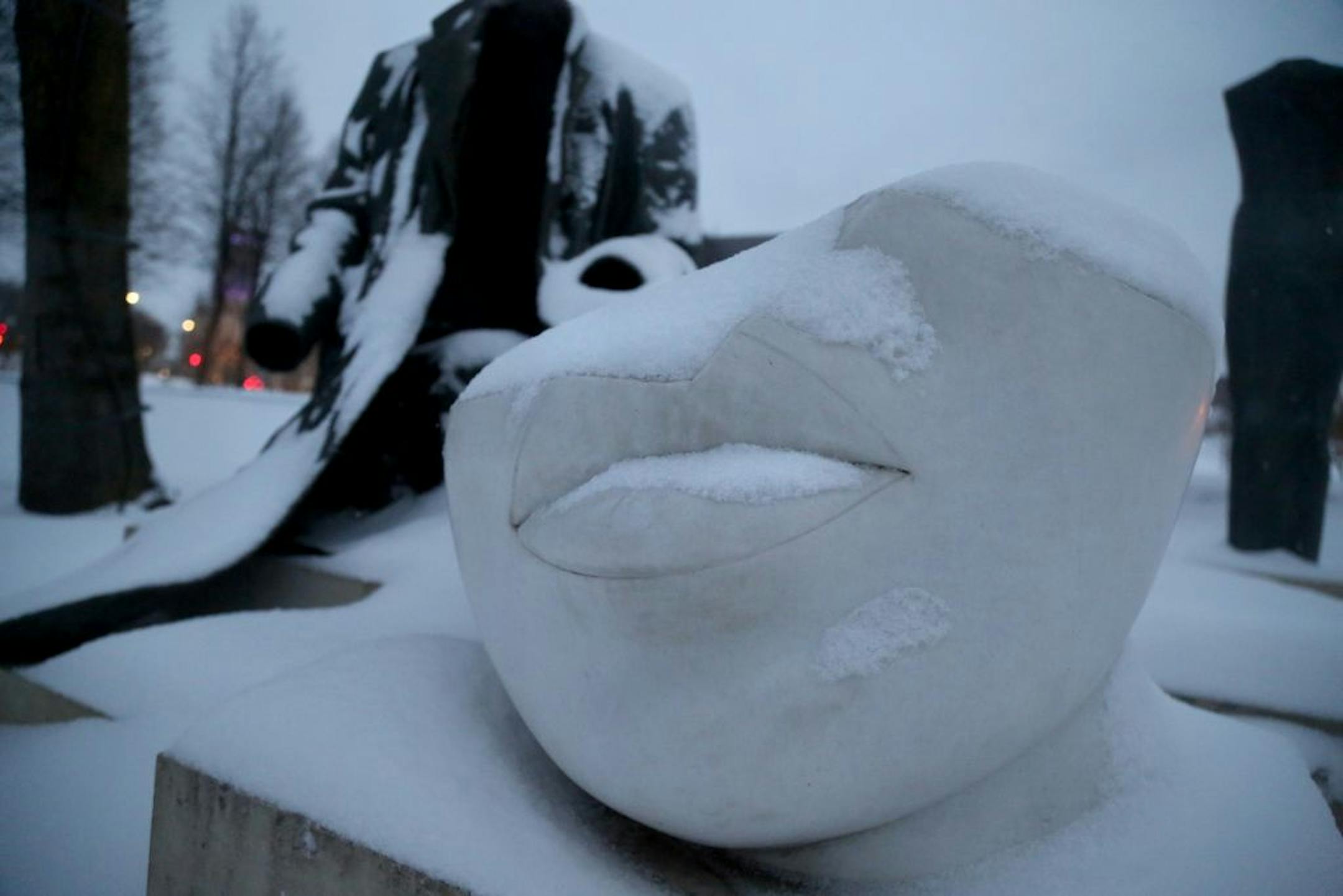 Fresh snow fall coats Judith Shea's figure grouping Without Words in the Walker Art Center Sculpture Garden Tuesday, March 6, 2018, in Minneapolis, MN.