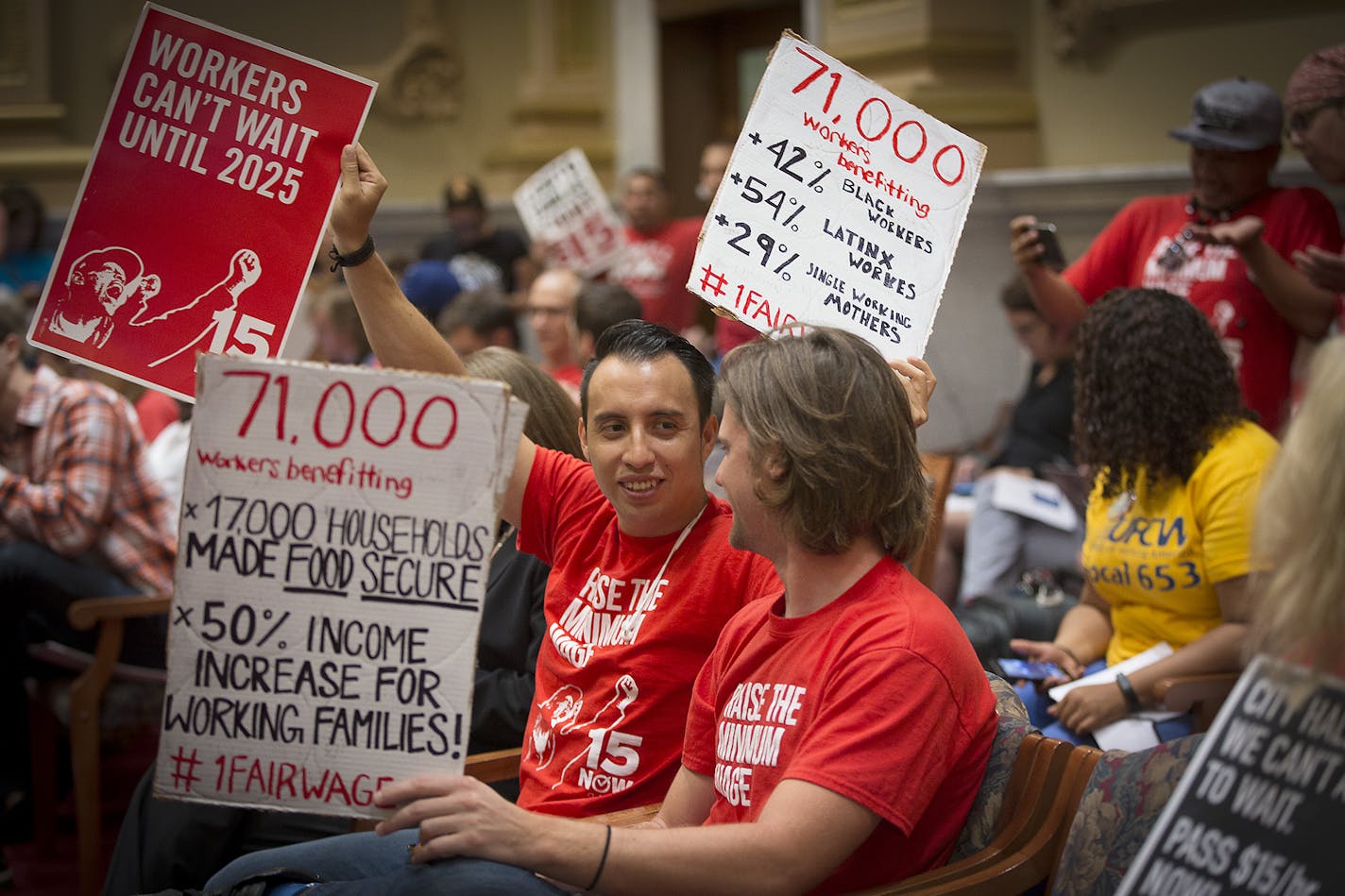 Supporters of the $15 minimum wage increase showed their support before it was passed by City Council at City Hall, Friday, June 30, 2017 in Minneapolis, MN.