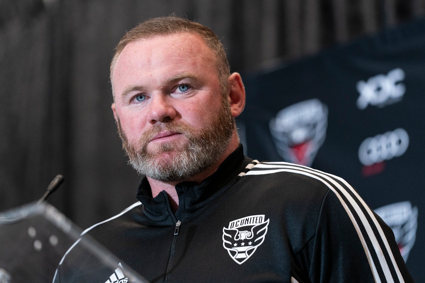 Wayne Rooney pauses while speaking during a news conference to announce him as the new head coach of MLS soccer club D.C. United, Tuesday, July 12, 2022, in Washington. (AP Photo/Alex Brandon)