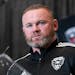 Wayne Rooney pauses while speaking during a news conference to announce him as the new head coach of MLS soccer club D.C. United, Tuesday, July 12, 20
