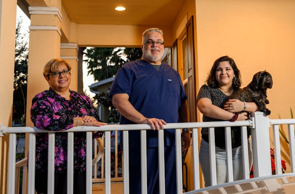 To save money after graduating from college, Nicole Solero, right, with her dog, Billy, moved back in with her parents, Wanda Alvira and Richard Soler
