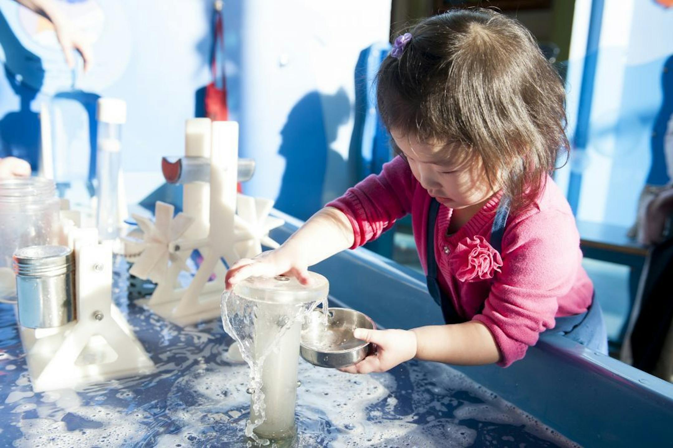 Lana Vue, 2, played with water at the Minnesota Children's Museum in St. Paul in March.