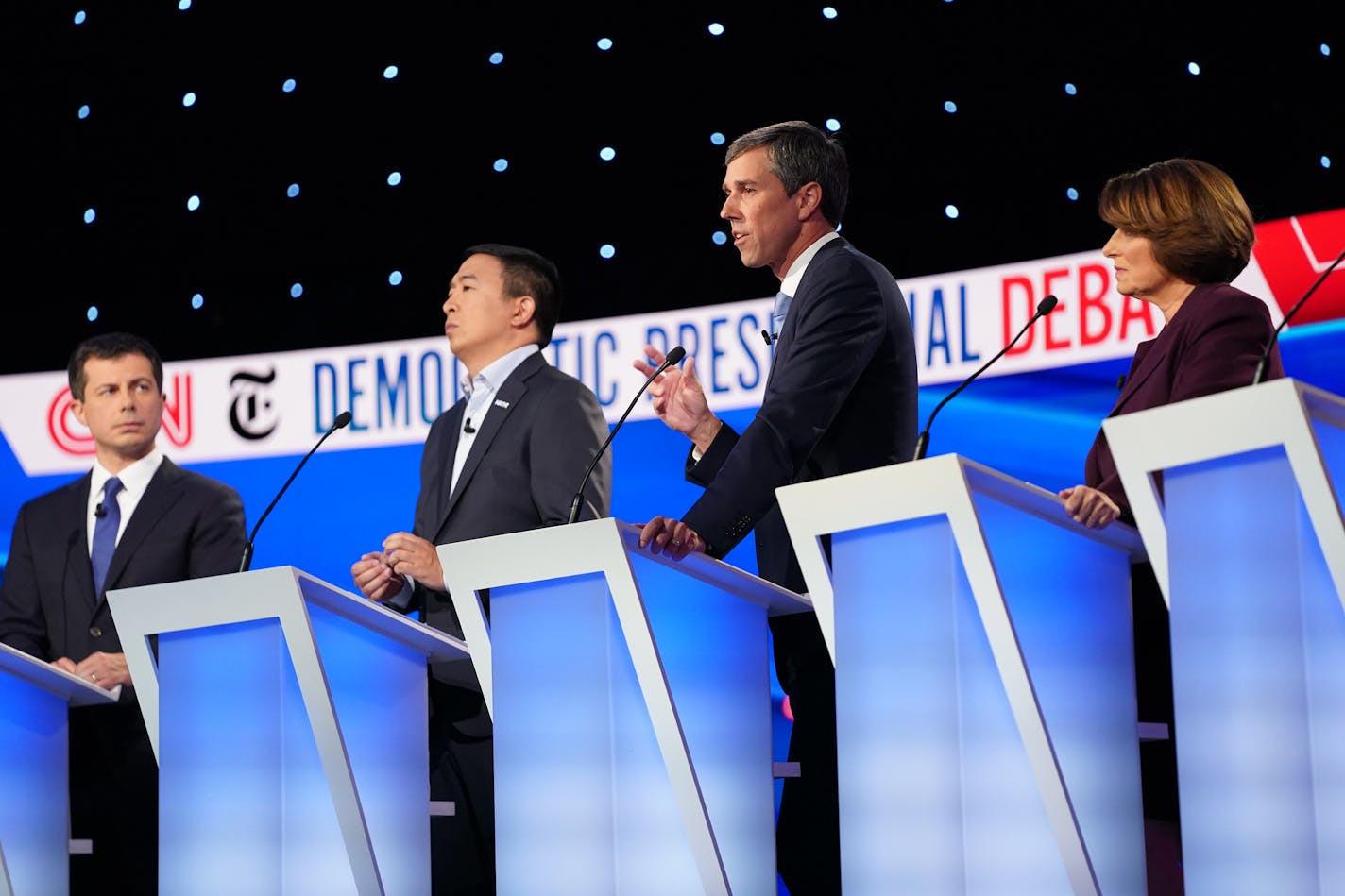 Former Rep. Beto O'Rourke of Texas, center right, speaks during the Democratic presidential debate at Otterbein University in Westerville, Ohio, on Tuesday, Oct. 15, 2019. From left, Mayor Pete Buttigieg of South Bend, Ind., the entrepreneur Andrew Yang, O'Rourke and Sen. Amy Klobuchar (D-Minn.). (Tamir Kalifa/The New York Times)