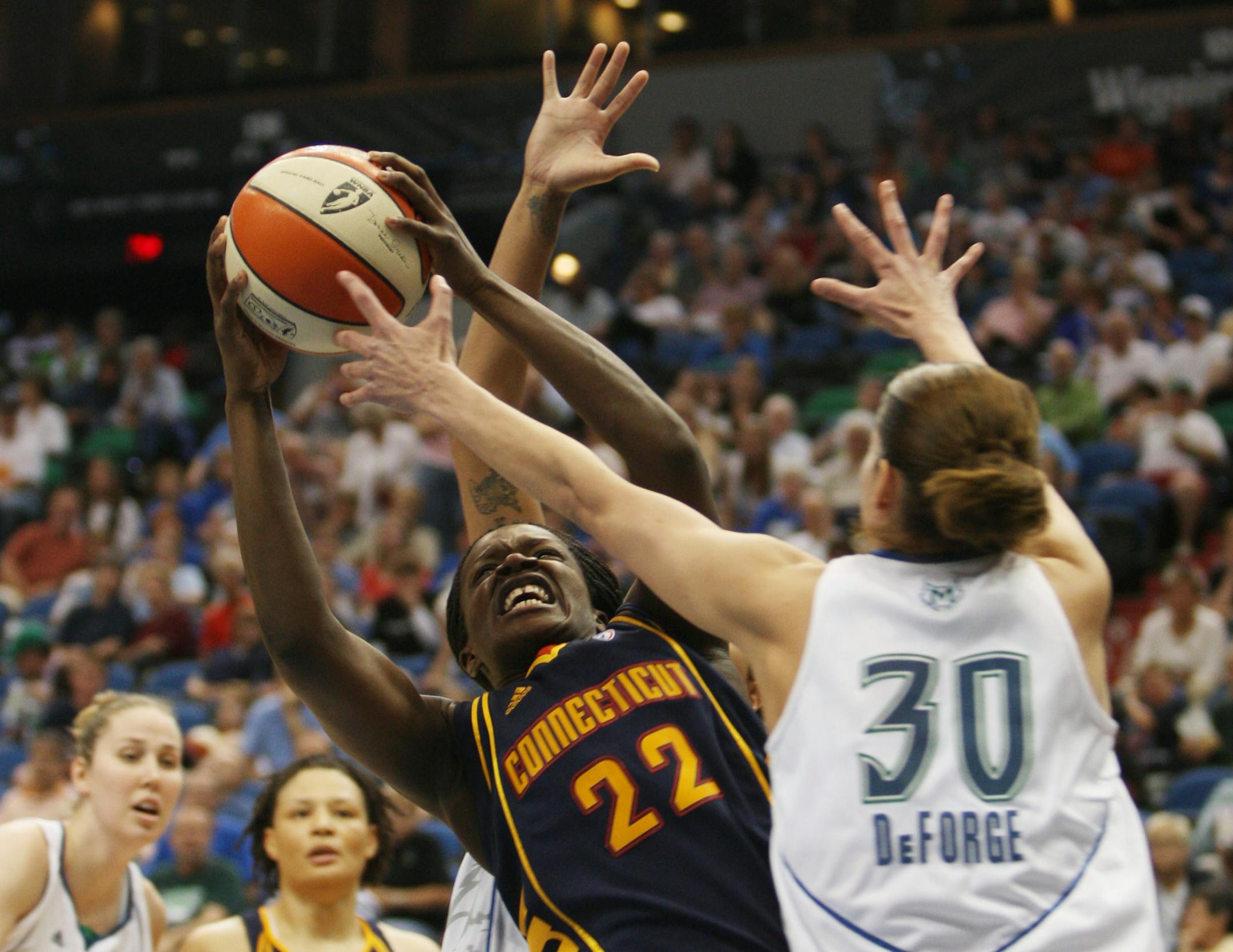 Connecticut's Barbara Turner pulled down a rebound over Anna DeForge in the second half on Tuesday night. Turner finished with 18 points and four rebounds.