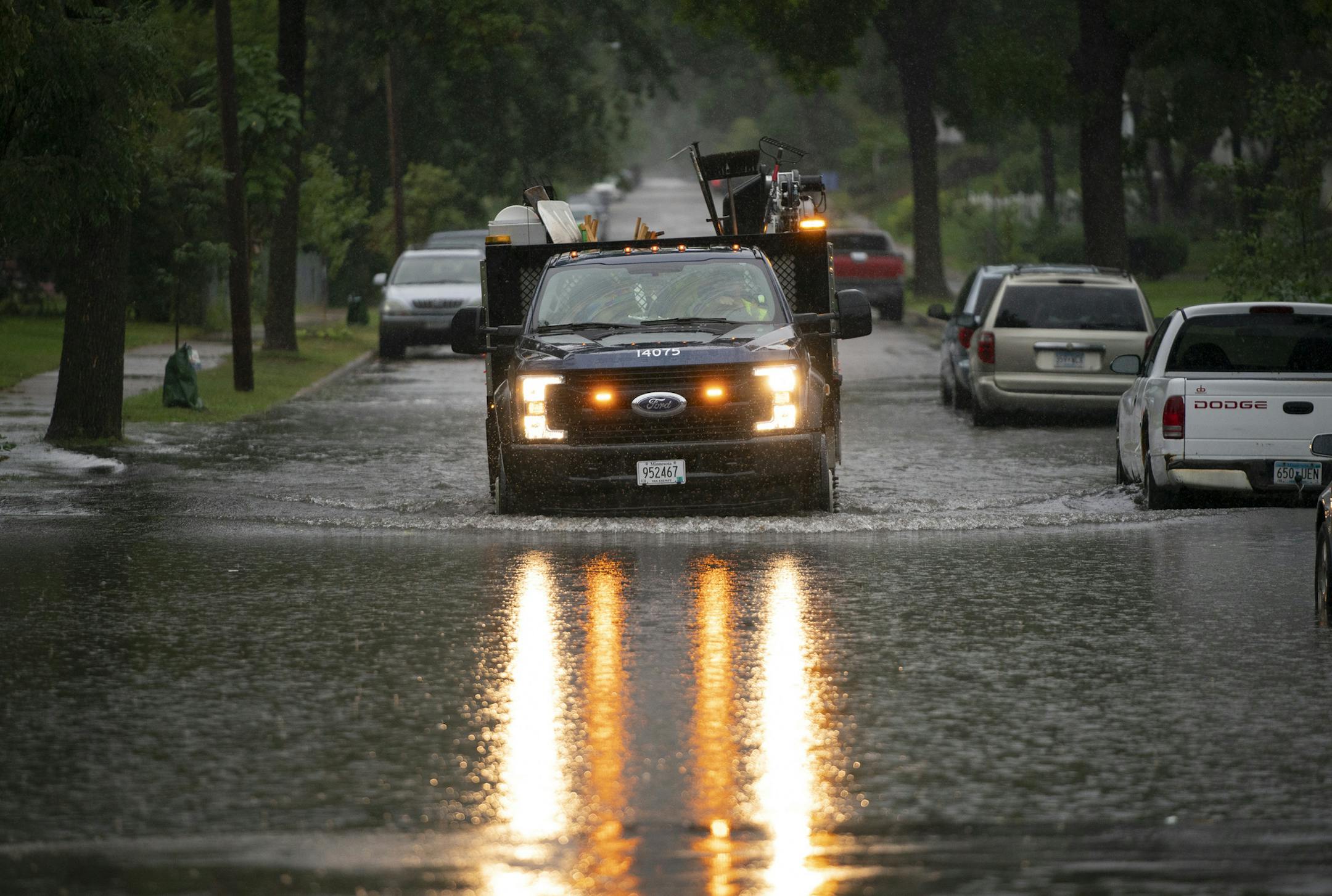 A city crew drove through standing water while placing traffic cones to warn of the situation on 16th Ave. S. at E. 42nd St. Thursday afternoon. ] JEFF WHEELER &#xef; jeff.wheeler@startribune.com Rain, heavy at times, soaked the Twins Cities Thursday afternoon, September 20, 2018.
