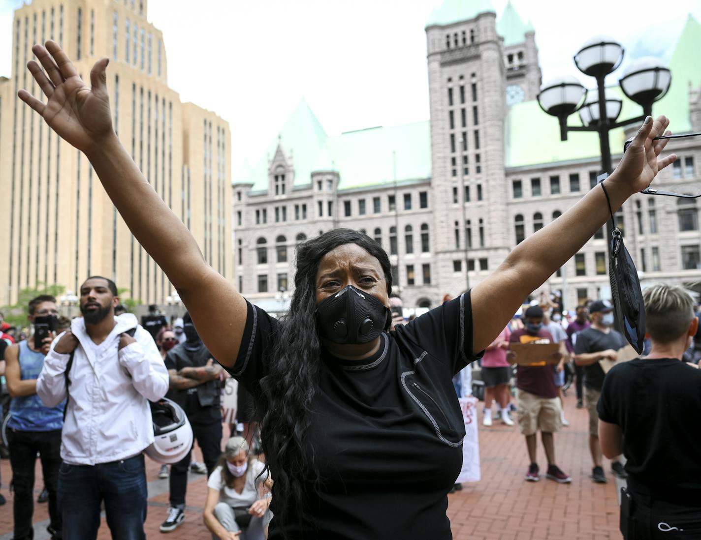 Tears streamed down the face of Felicia Johnson, of St. Paul as she was overcome with grief during the reading of names of people killed by police Saturday outside the Hennepin County Government Center. "I am tired of being sick and tired," said Johnson. "I'm here to stand for truth. I'm here to stand for justice. I'm here to stand for Righteousness." ] aaron.lavinsky@startribune.com The "International Solidarity Day of Protest Against Police Terror" was held Saturday, June 13, 2020 outside the