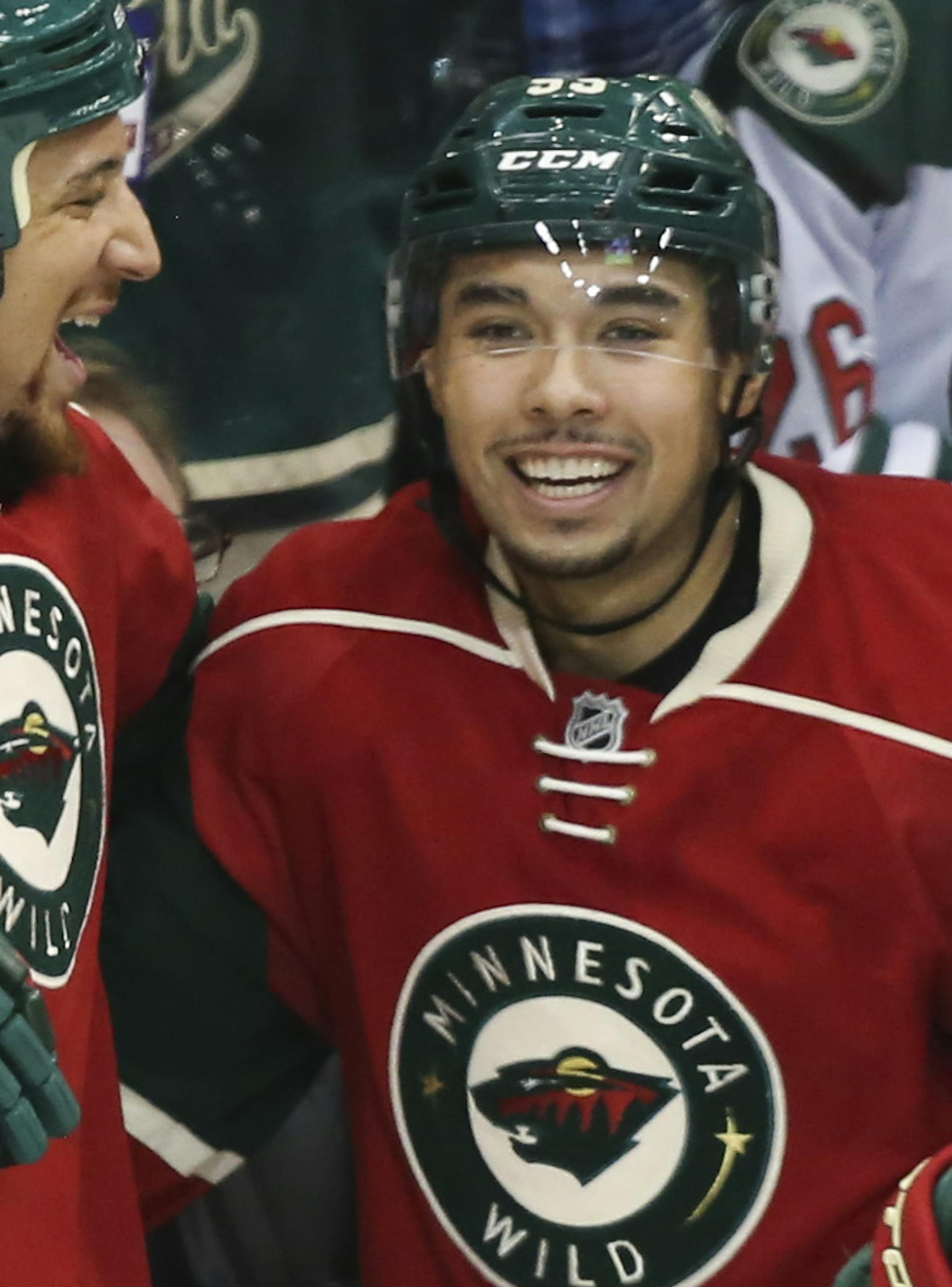 Teammates celebrated with Wild's Matt Dumba (second from left) after he scored in the second period. ] RENEE JONES SCHNEIDER • reneejones@startribune.com The Minnesota Wild played the Ottawa Senators on Tuesday, March 3, 2015 in at the Xcel Energy Center in St. Paul, Minn. ORG XMIT: MIN1503032302000746