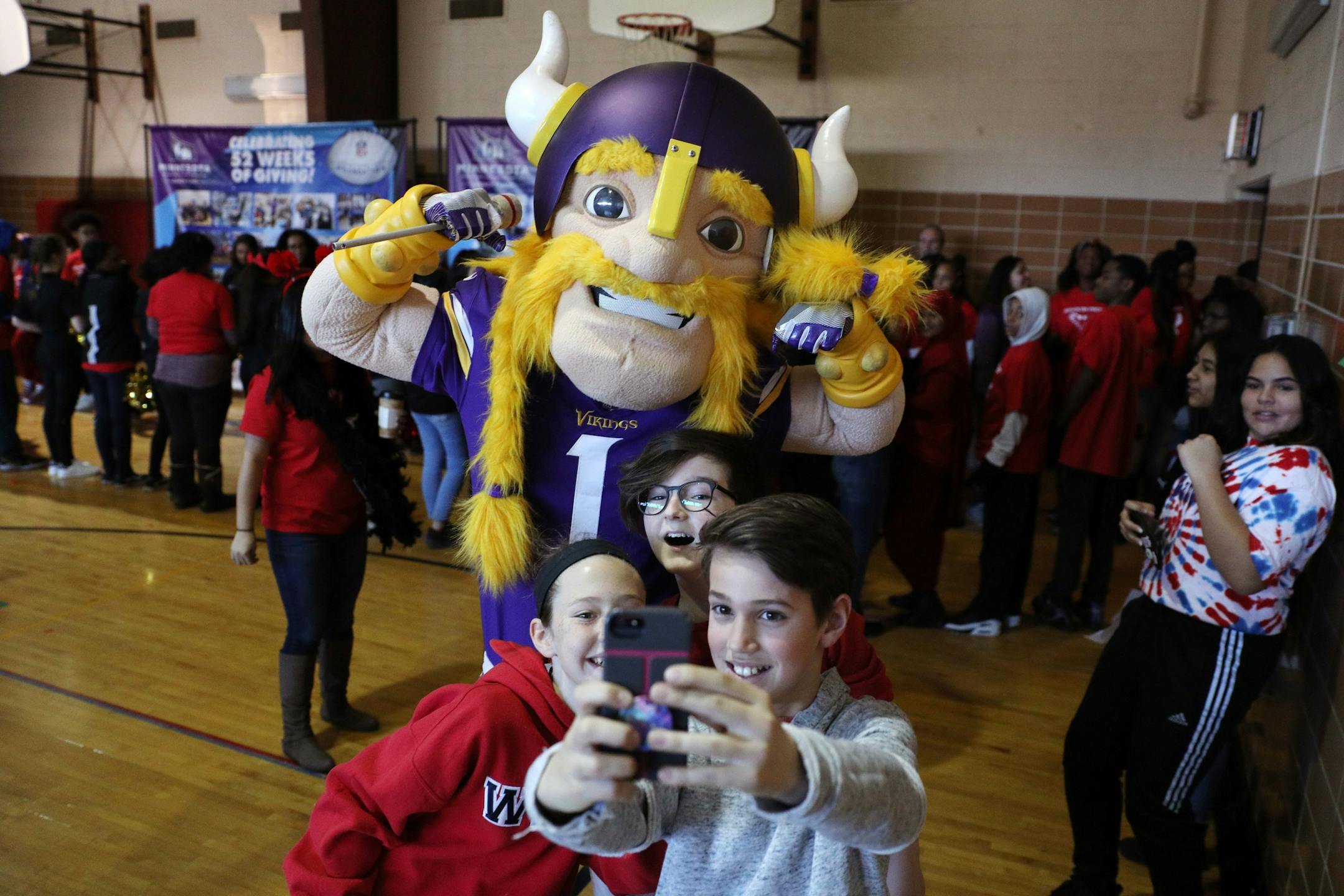 Minnesota Vikings mascot Viktor the Viking posed for photos with students as they waited for the start of Thursday's event.