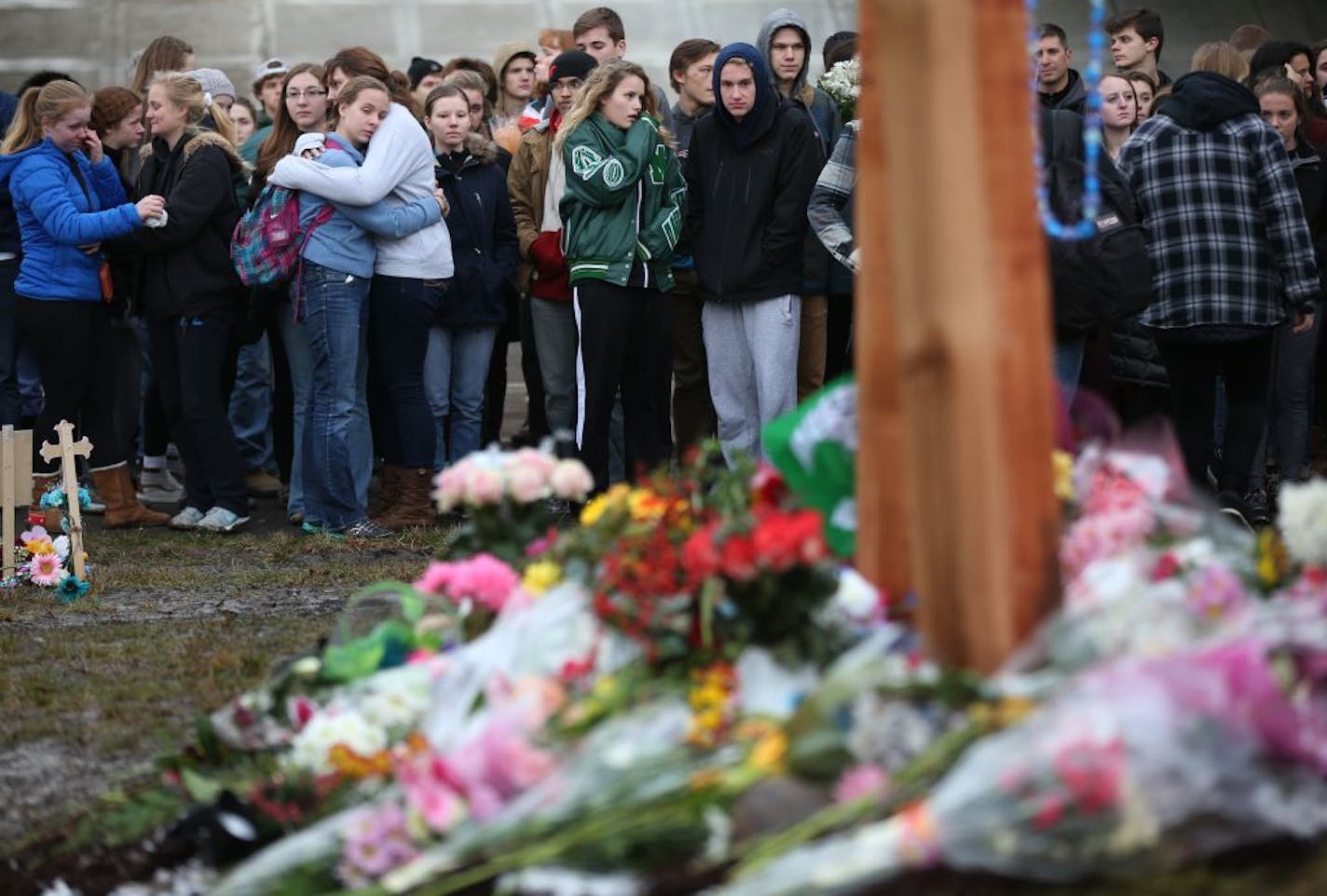 Students from Mounds View High school gathered at the crash scene along hwy 96 where they left memorials for two students that were killed in a traffic accident December 05,2016 in Mounds View, MN.