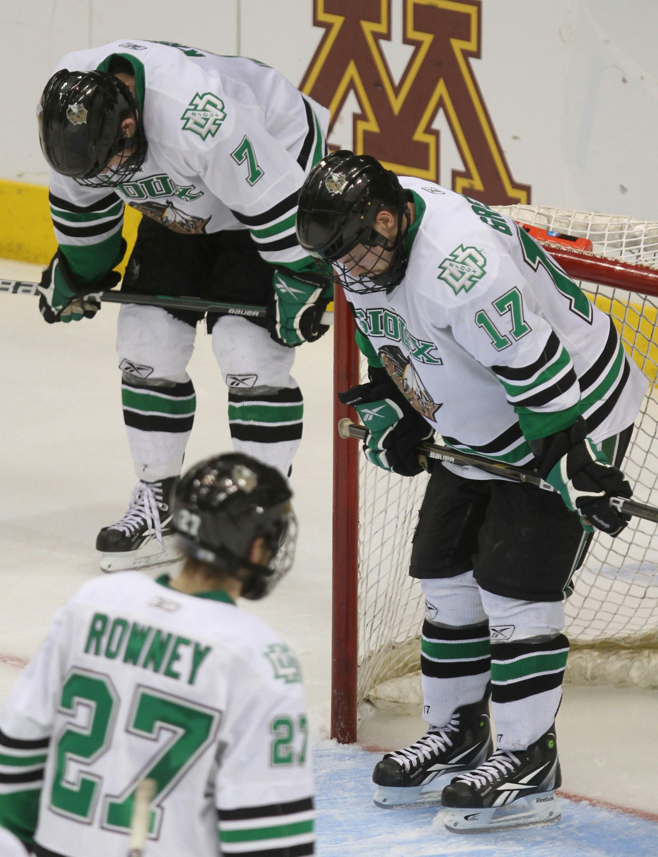 BRUCE BISPING �\u20AC� bbisping@startribune.com
St. Paul, MN., Thursday, 4/7/11] NCAA Frozen Four Semifinals, North Dakota vs Michigan. (left to right) North Dakota's Danny Kristo, Carter Rowney and Jason Gregorie were dejected at the end of the game.