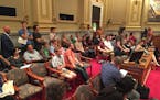 A crowd gathered at Minneapolis' City Hall over news that development of a parking lot could bring closure of Acme Comedy Co.