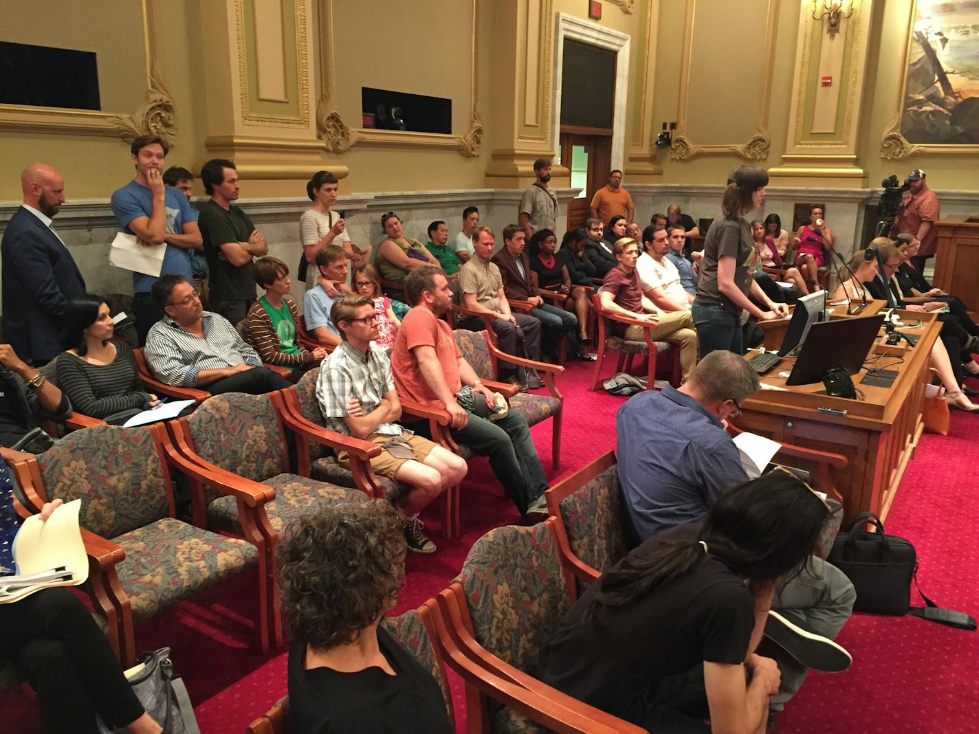 A crowd gathered at Minneapolis' City Hall over news that development of a parking lot could bring closure of Acme Comedy Co.