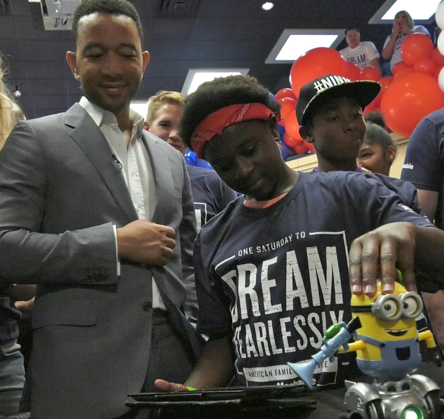 Grammy-winning musician John Legend watched as Tanyla controlled a robotic Minion through an iPad at one of the stations at a Big Brother/Big Sister event at the Fine Line Music Cafe in Minneapolis.] Shari L. Gross &#xef; shari.gross@startribune.com Grammy-winning pop/R&B music star John Legend made a surprise appearance at a Big Brothers Big Sisters of the Greater Twin Cities event at the Fine Line Music Cafe in Minneapolis, Minn. on Saturday, August 19, 2017.