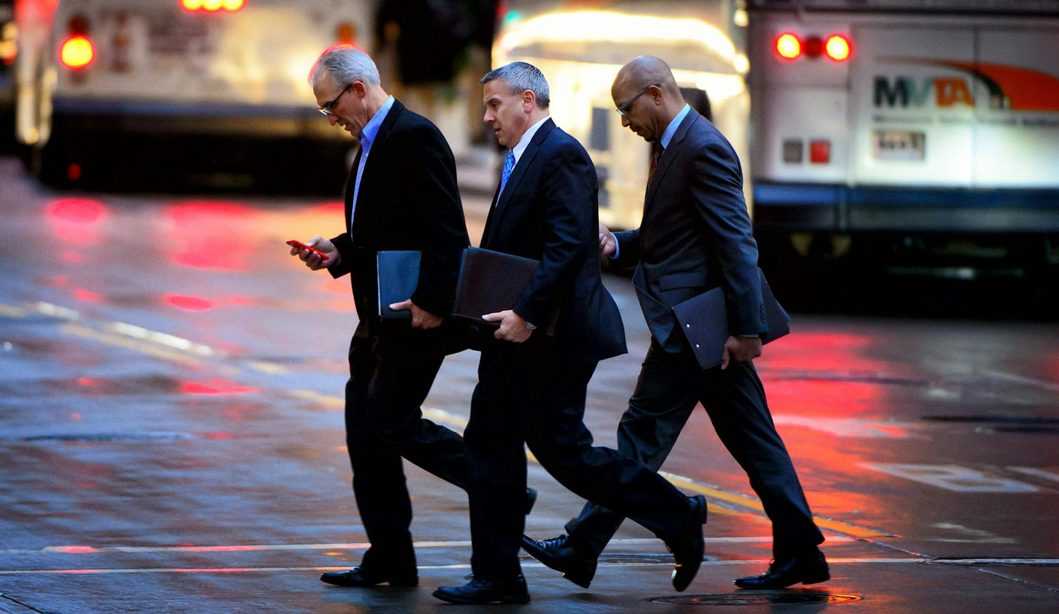 Pedestrians use their mobile devices during the evening rush hour neat the Nicollet light rail station near 5th St and Marquette Ave. ] GLEN STUBBE * gstubbe@startribune.com Wednesday, December 16, 2015 From cellphone distracted drivers whizzing through crosswalks and rolling through red lights, and pedestrians more mindful of their social media interactions than looking both ways before crossing the street and train tracks, it's been a deadly year for Minnesotans on foot, with 38 pedestrian dea