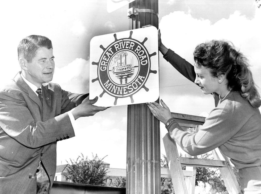 Gov. Orville Freeman helped Valora Allen, Miss Minnesota Highways, put up the first Great River Road marker in 1959 near the State Capitol.