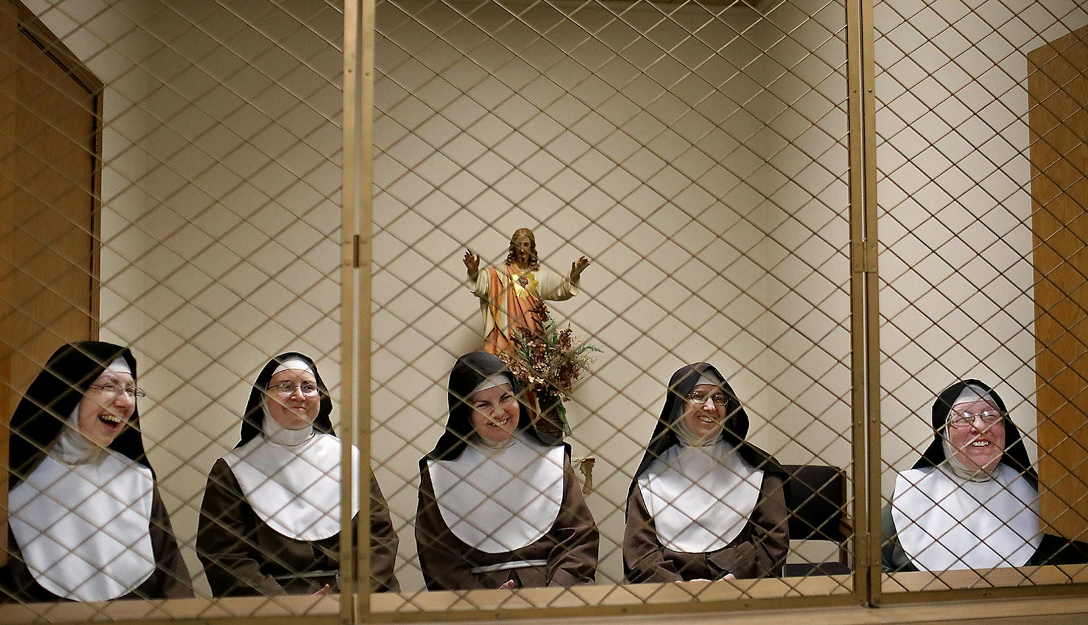 Poor Clare nuns of St. Clare's Monastery nuns met with journalists in the monastery's parlor, the one room where outsiders have partial access to the nuns in a room divided by a metal fencing with a folding wooden divider and seen Thursday, April 16, 2020, in Sauk Rapids, MN. Nuns pictured are Mother Marie Immaculata, left to right, Sister Mary Christiana, Sister Mary Matthew, Sister Marie Elizabeth and Mother Mary Barbara.