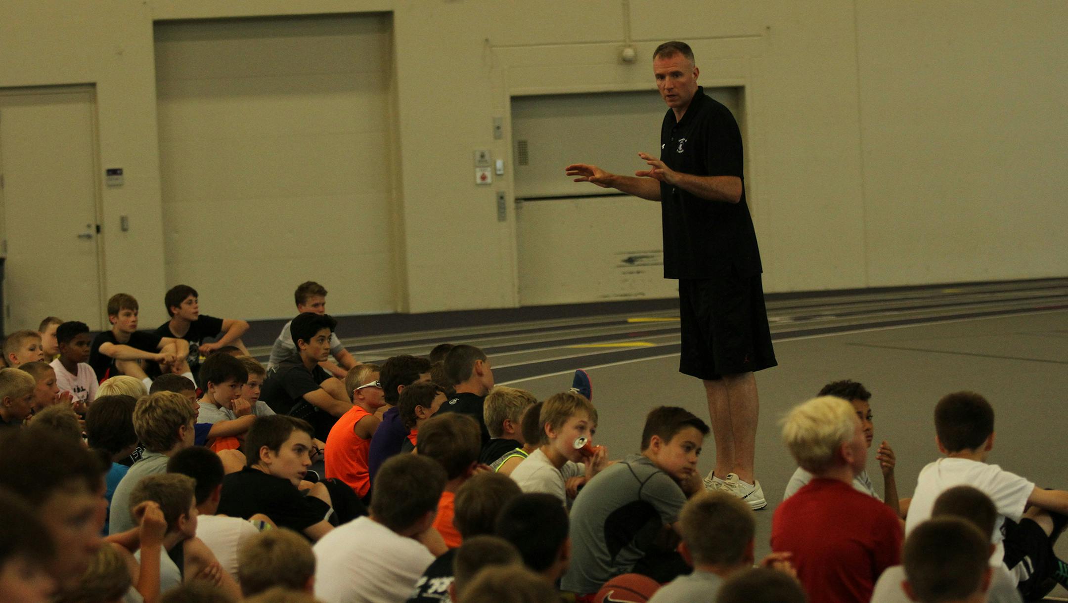 John Tauer at a youth basketball camp. credit: University of St. Thomas