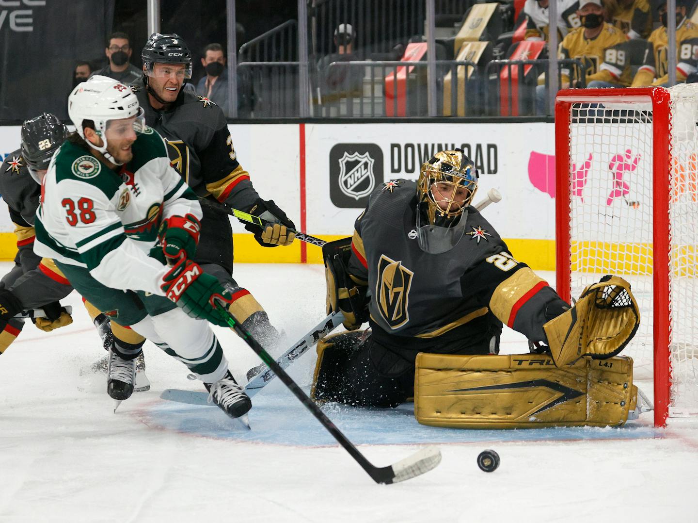 Vegas Golden Knights goaltender Marc-Andre Fleury (29) tries to take the post away from the Minnesota Wild's Ryan Hartman (38) in the first period in Game 2 of the first round of the playoffs at T-Mobile Arena in Las Vegas on Tuesday, May 18, 2021. (Ethan Miller/Getty Images/TNS) ORG XMIT: 16716720W