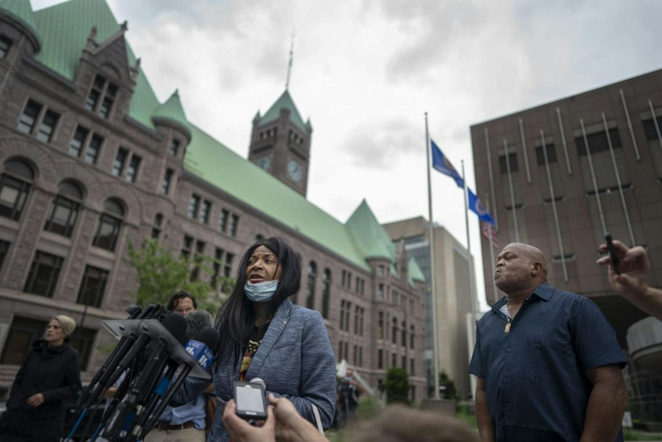 George Floyd aunt Angela Harrelson of Minneapolis left and his uncle Selwyn Jones of Gettysburg, South Dakota spoke to the members of the media outside of the Hennepin County Public Safety Facility Monday morning .
