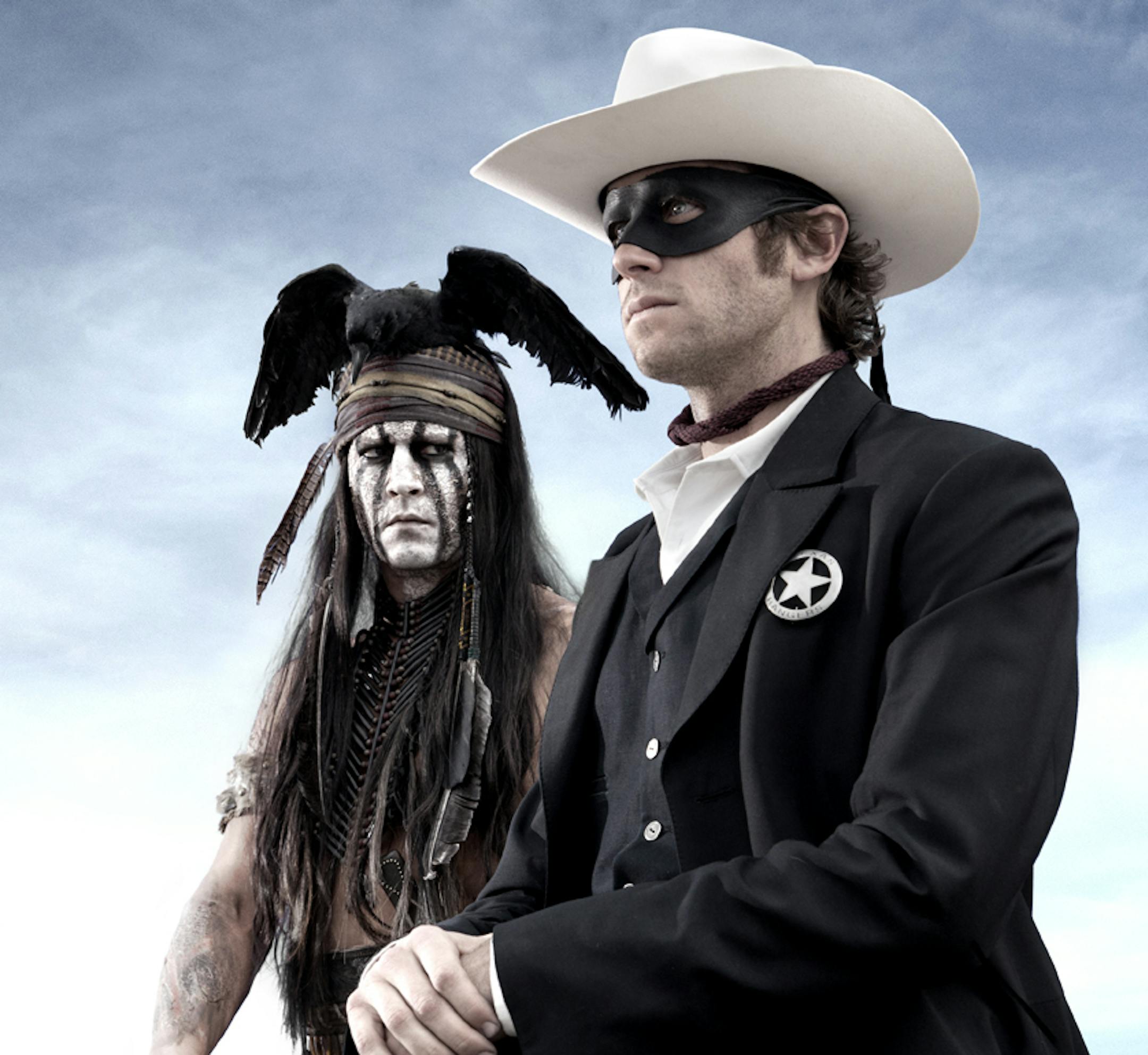 This publicity image released by Disney shows Johnny Depp as Tonto, left, and Armie Hammer as The Lone Ranger, in a scene from "The Lone Ranger." (AP Photo/Disney Enterprises, Inc., Peter Mountain) ORG XMIT: MIN2013072514181355