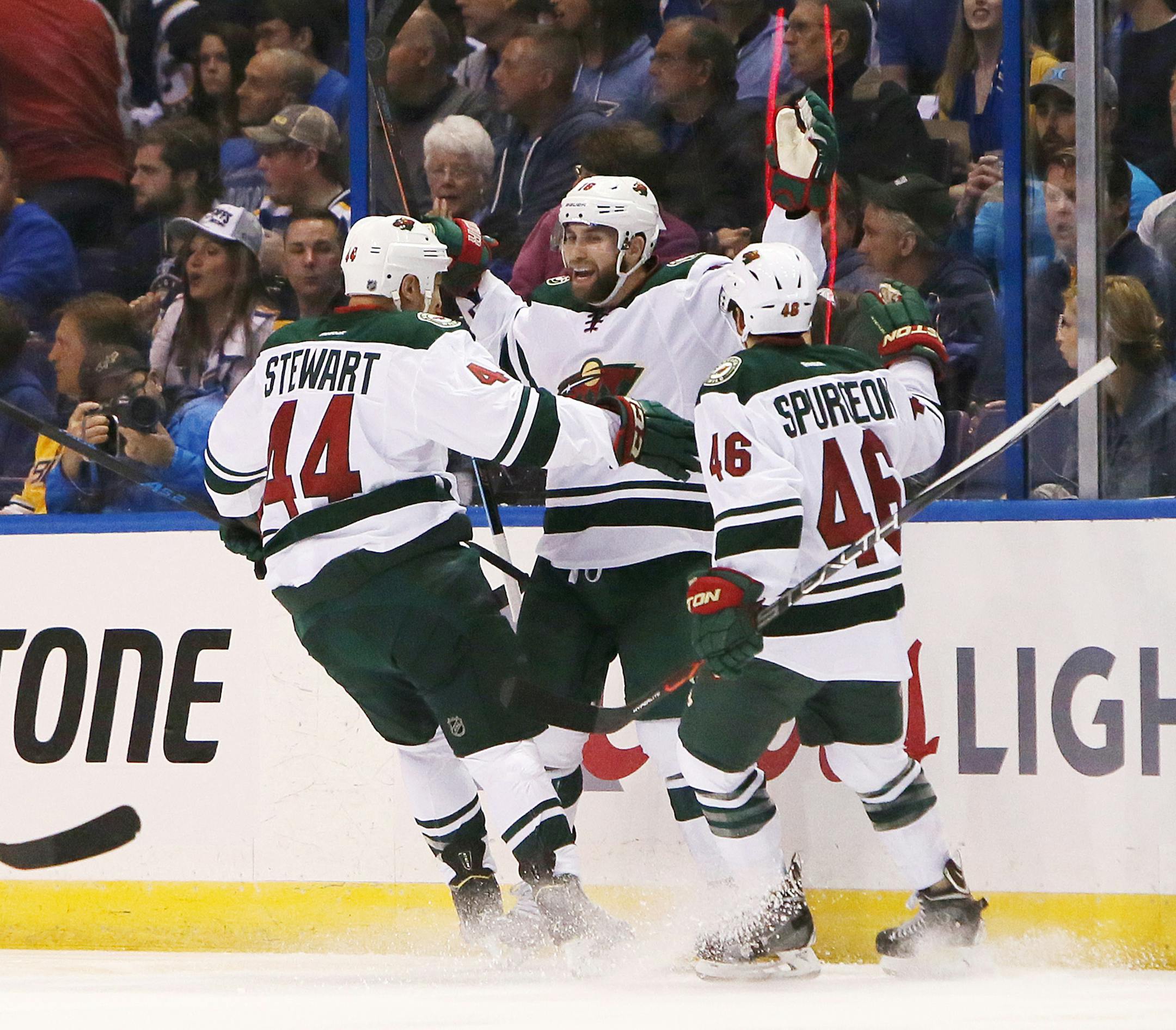 The Minnesota Wild's Jason Zucker, middle, reacts after scoring against the St. Louis Blues in the first period during the first round of the NHL playoffs at the Scottrade Center in St. Louis on Thursday, April 16, 2015. (Chris Lee/St. Louis Post-Dispatch/TNS) ORG XMIT: 1166792