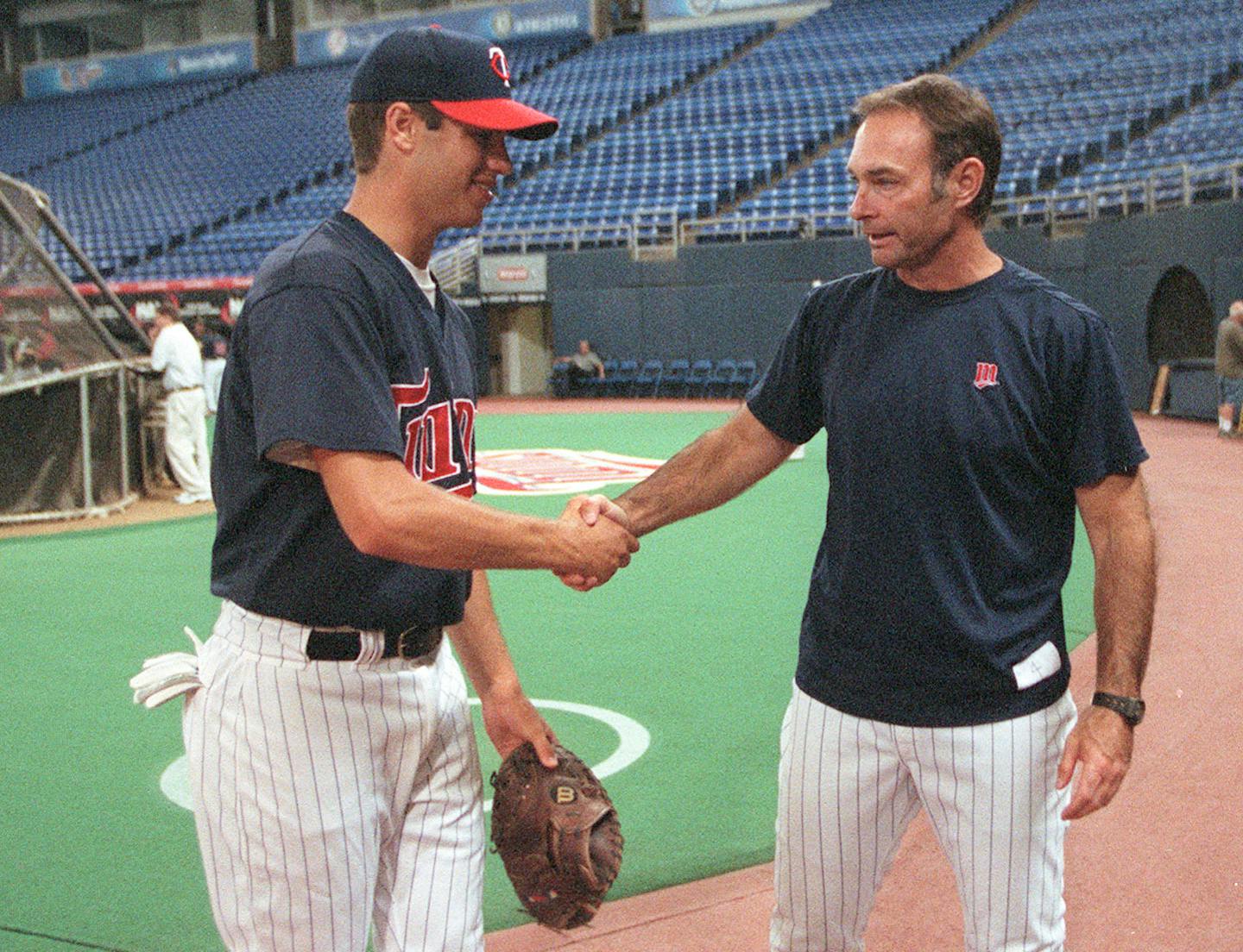 Joe Mauer and Paul Molitor - both Cretin-Derham Hall graduates - exchanged pleasantries in 2001 after Mauer was drafted by the Twins. Now Molitor is out as manager and Mauer is contemplating retirement.