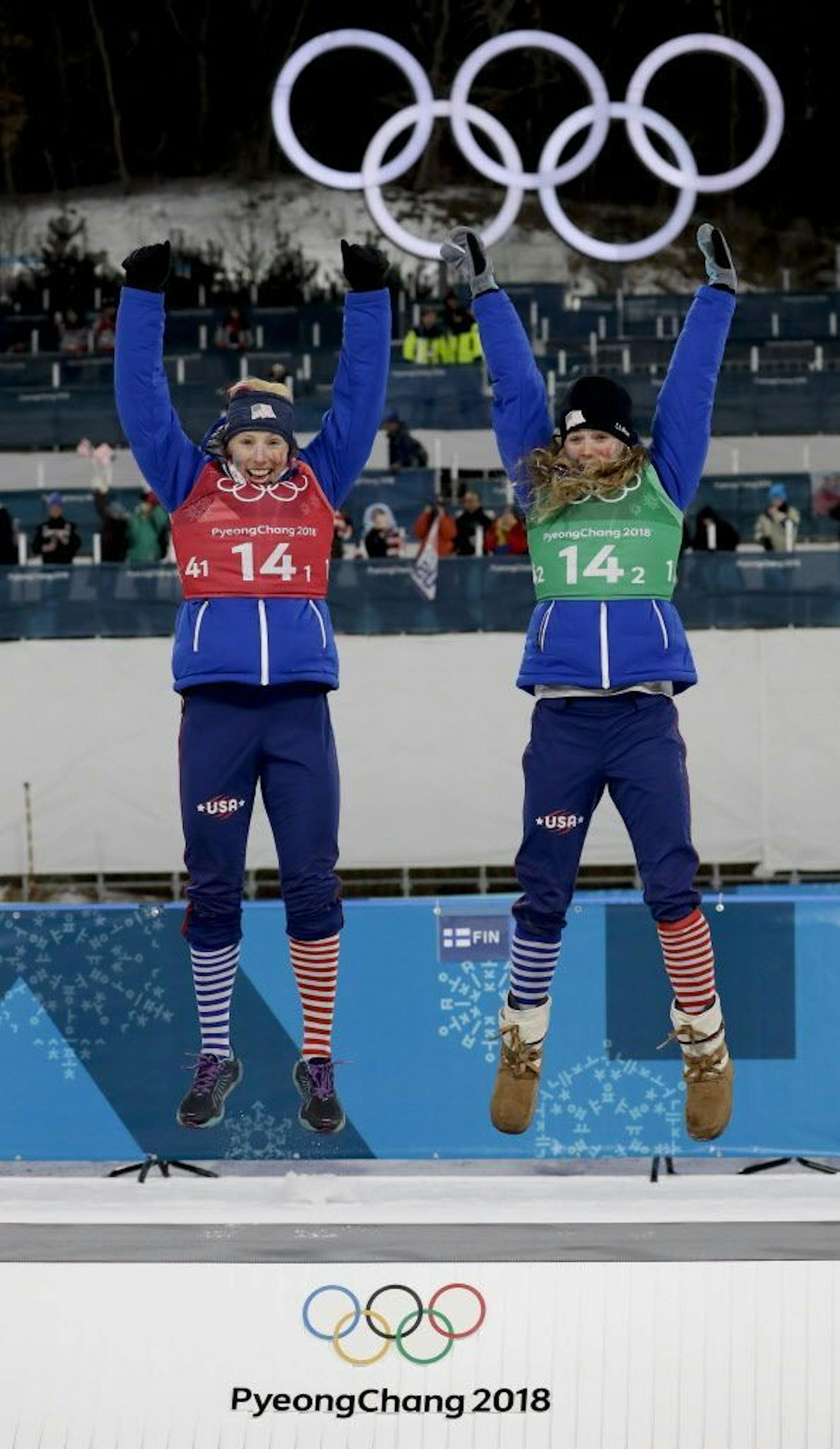 United States' Jessie Diggins, right, and Kikkan Randall celebrate after winning the gold medal in the women's team sprint freestyle cross-country skiing final at the 2018 Winter Olympics.