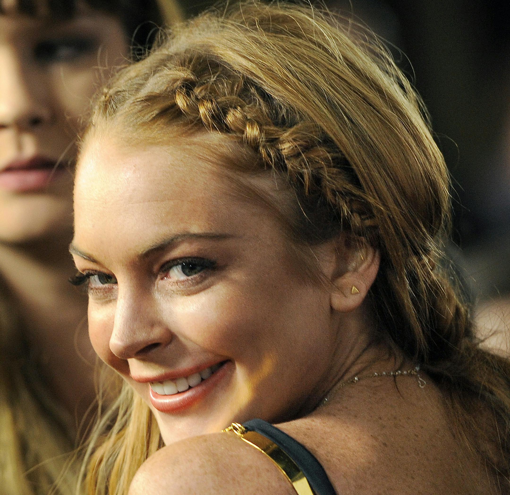 FILE - This April 11, 2013 file photo shows actress Lindsay Lohan, a cast member in "Scary Movie V," at the premiere of the film in Los Angeles. Lohan's lawyer Mark Jay Heller told a judge at a May 2, 2013 hearing that Lohan had checked into a rehab facility per a judge's orders. (Photo by Chris Pizzello/Invision/AP, file)