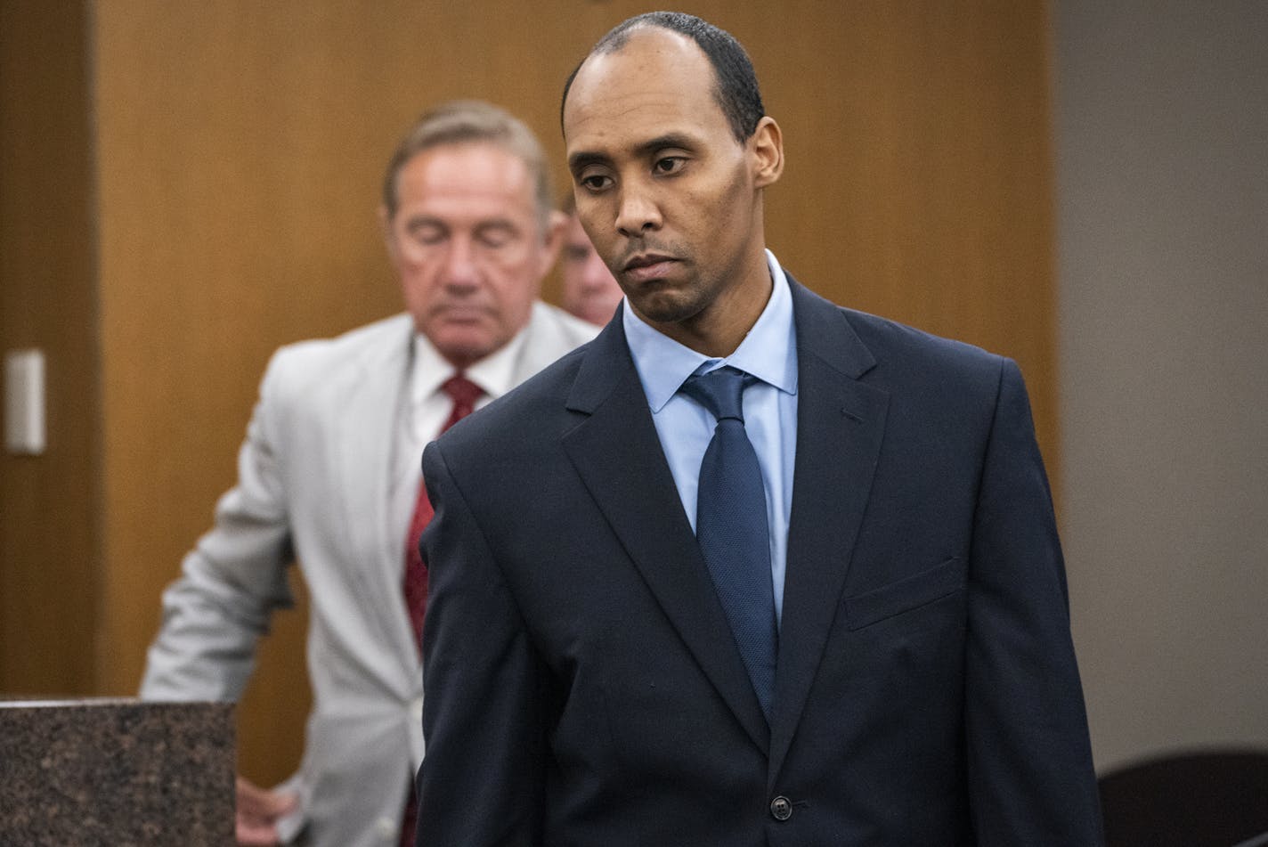 Mohamed Noor walks to the podium to be sentenced. Former Minneapolis police officer Mohamed Noor is sentenced by Judge Kathryn Quaintance in the fatal shooting of Justine Ruszczyk Damond in Hennepin County District Court in Minneapolis Friday, June 7, 2019. (Leila Navidi/Minneapolis Star Tribune/TNS ORG XMIT: 1326520