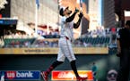 The Twins' Carlos Correa points skyward after homering in the first inning against the Mariners on Wednesday night.