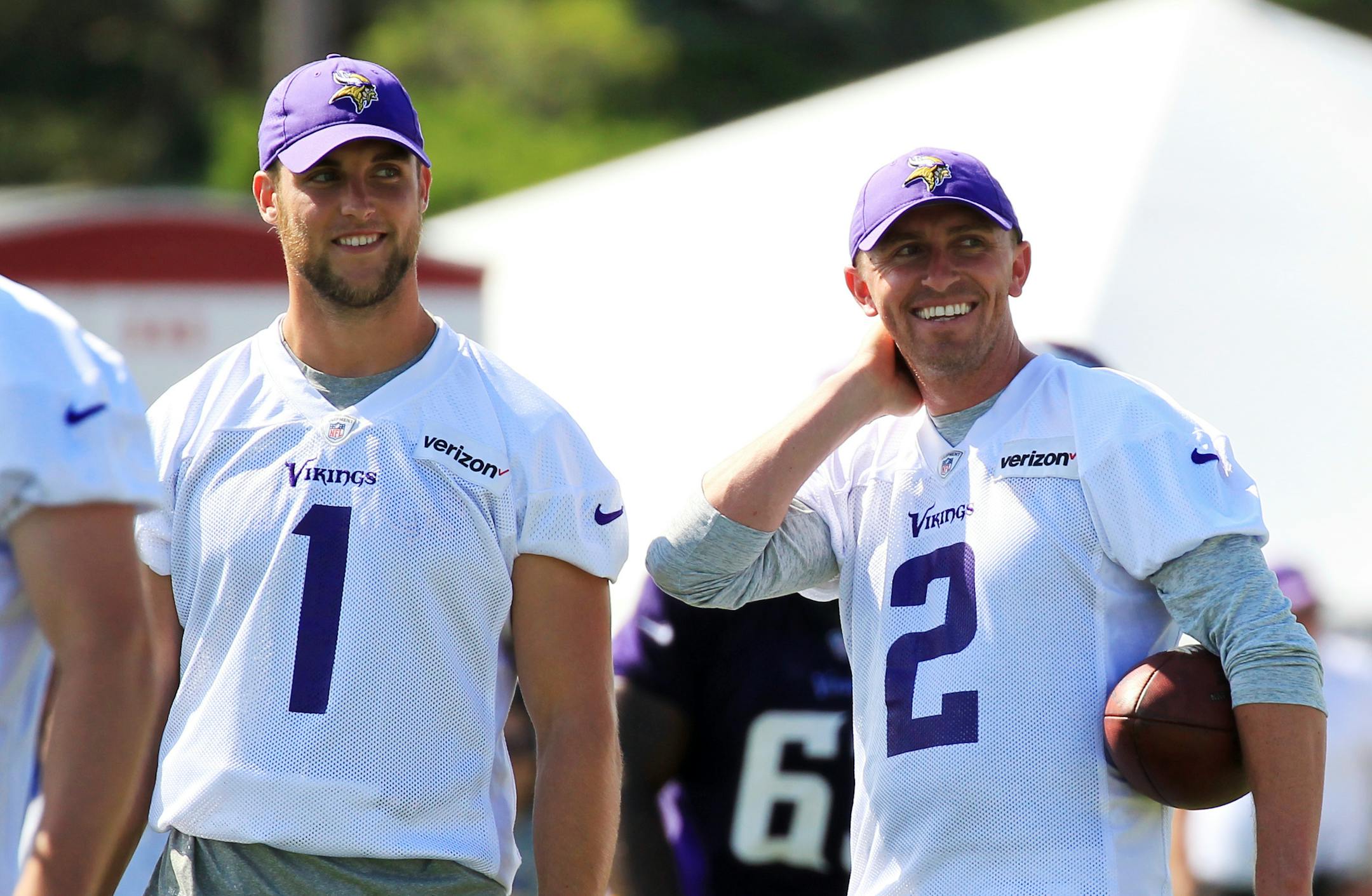 Minnesota Vikings kickers Marshall Koehn (1) and Kai Forbath (2) share a light moment during training camp.