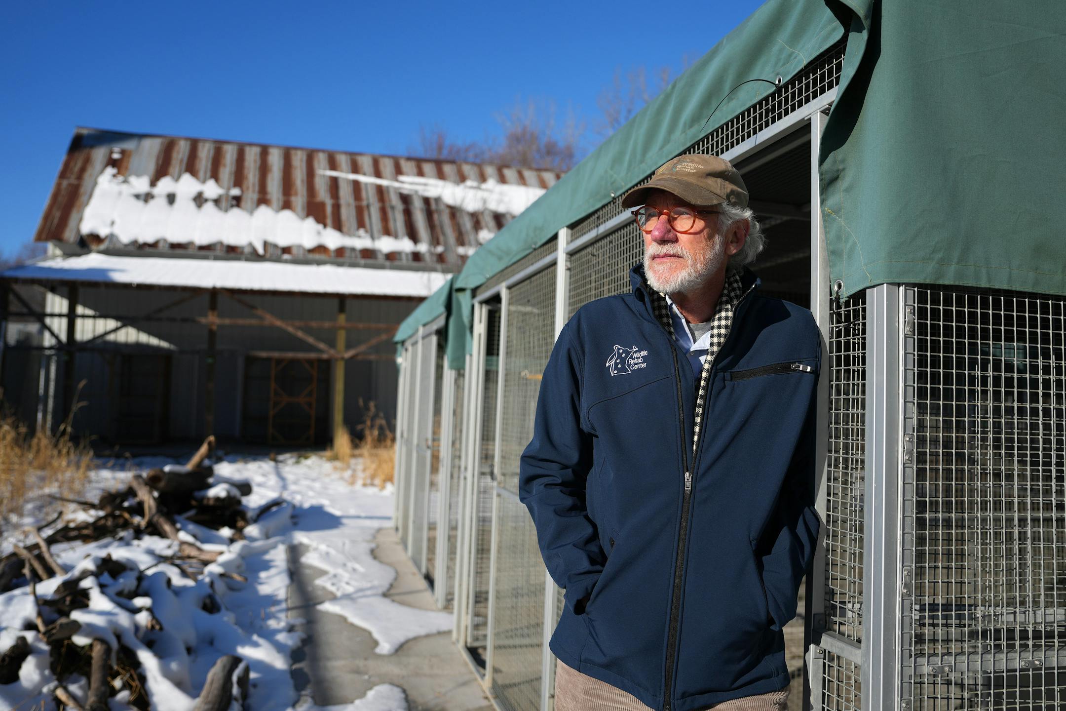 Wildlife Rehabilitation Center executive director Phil Jenni stood near some rehabilitation cages used for raccoons at the site of the proposed expansion.