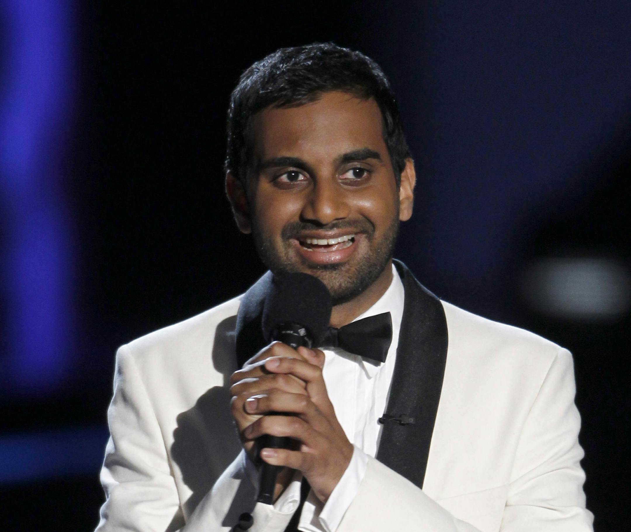 Host Aziz Ansari is seen on stage at the MTV Movie Awards in Universal City, Calif., on Sunday, June 6, 2010. (AP Photo/Matt Sayles) ORG XMIT: MIN2013032716293810 ORG XMIT: MIN1303271636171709