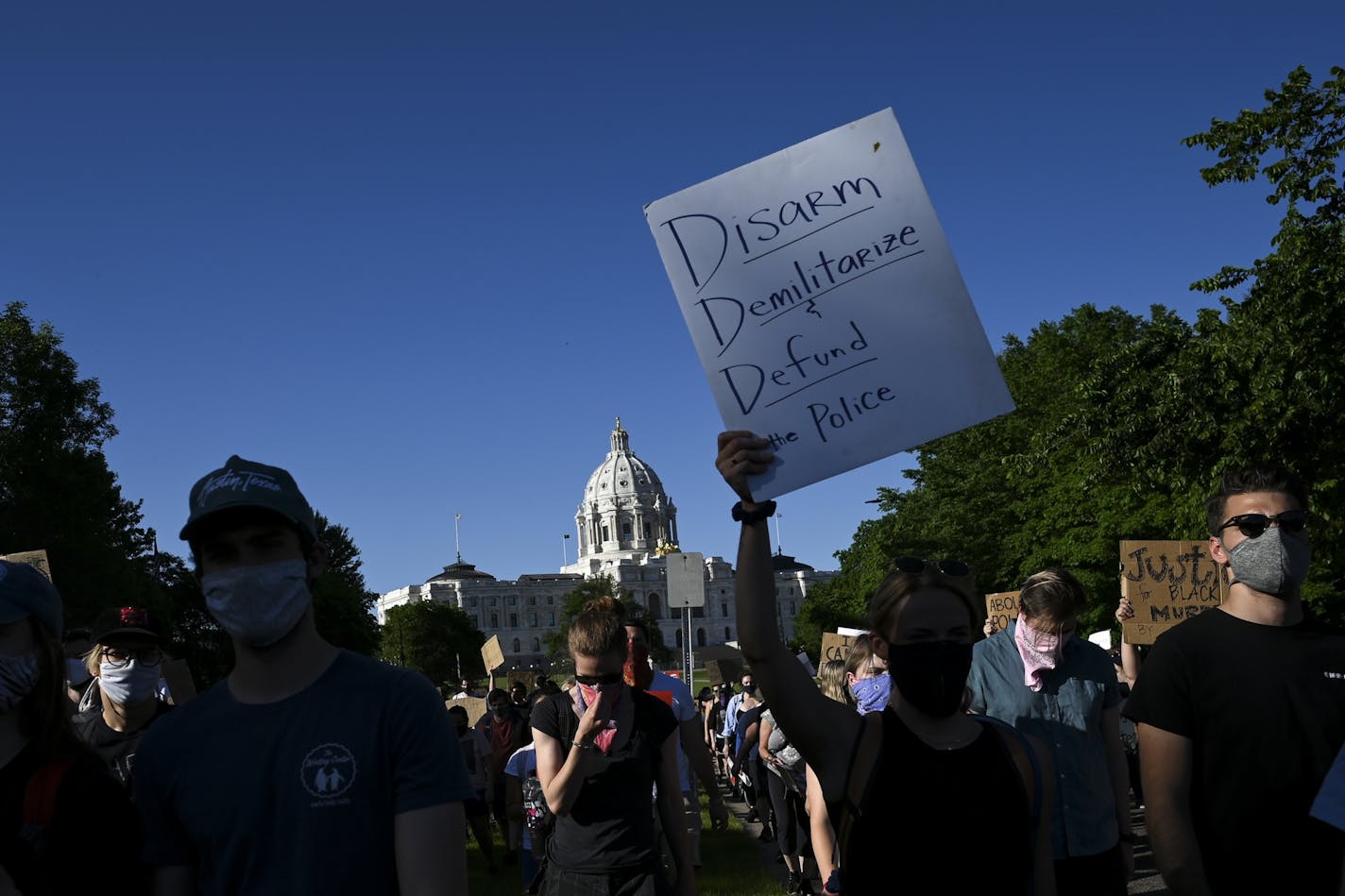 Protesters marched toward downtown St. Paul from the State Capitol on Friday night. More than 1,000 had gathered at Attorney General Keith Ellison's office.