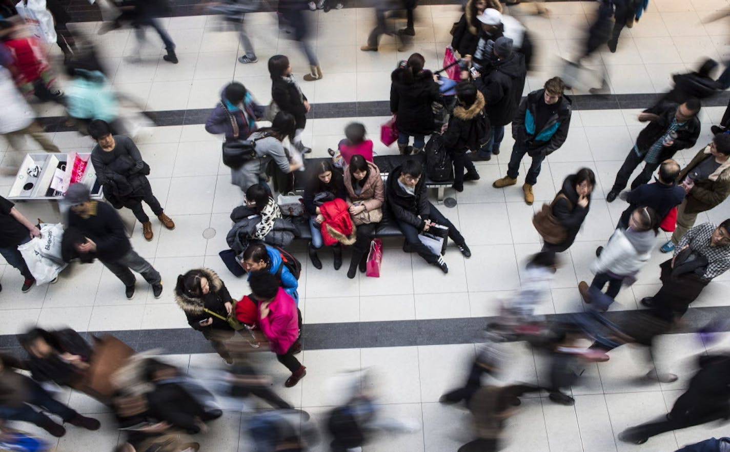 Shoppers make their way through the Eaton Centre as they visit the Boxing Day sales in Toronto on Thursday, Dec. 26, 2013. Boxing Day, observed in Canada, the United Kingdom, and other Commonwealth nations on the day after Christmas, is primarily known as a shopping holiday, much like Black Friday in the United States. (AP Photo/The Canadian Press, Chris Young)