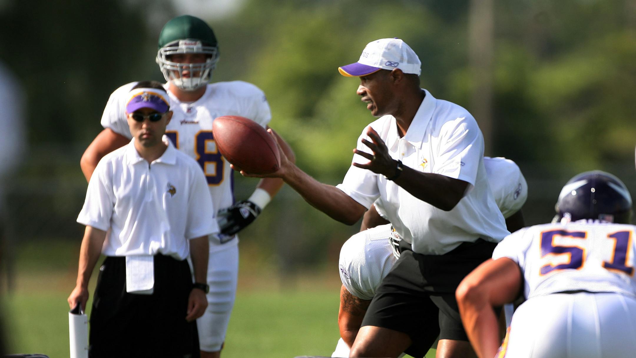 Vikings defensive coordinator Leslie Frazier runs drills in Mankato.