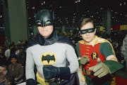 FILE - In this Sunday, Jan. 27, 1989 file photo, actors Adam West, left, and Burt Ward, dressed as their characters Batman and Robin, pose for a photo